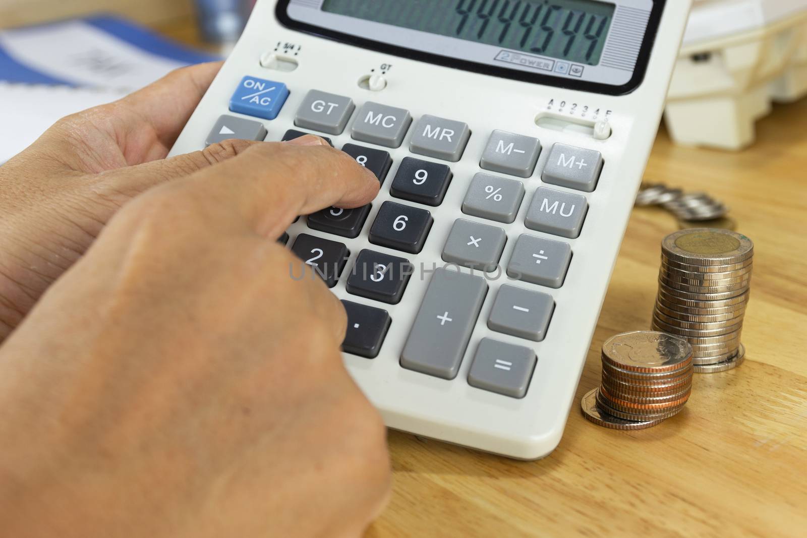 businessman use a calculator to calculate income and expenses in the office concepts, accounting, finance, investment