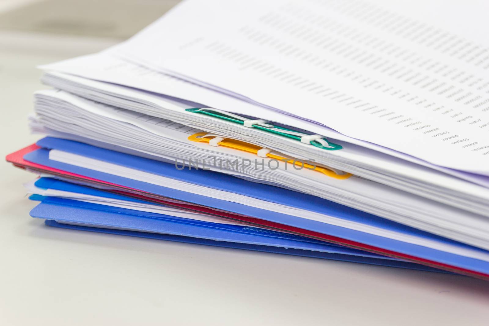 file folder and Stack of business report paper file on the table in a work office, concept document in work office