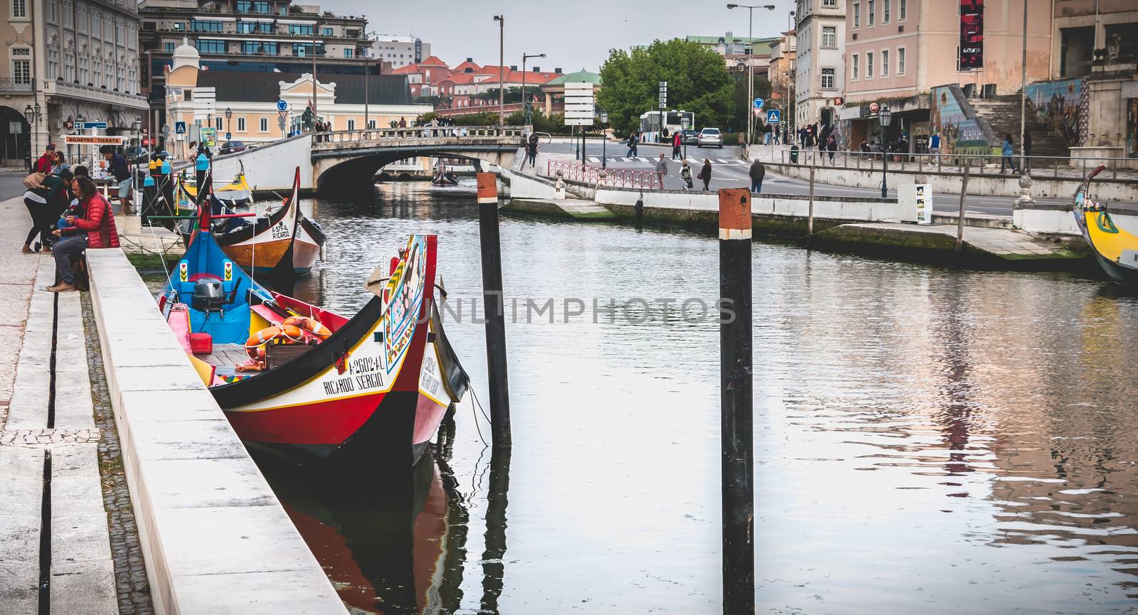 Aveiro, Portugal - May 7, 2018: view at the dock of the famous Moliceiros, traditional boats that used to harvest algae once and now transport tourists to the city canals