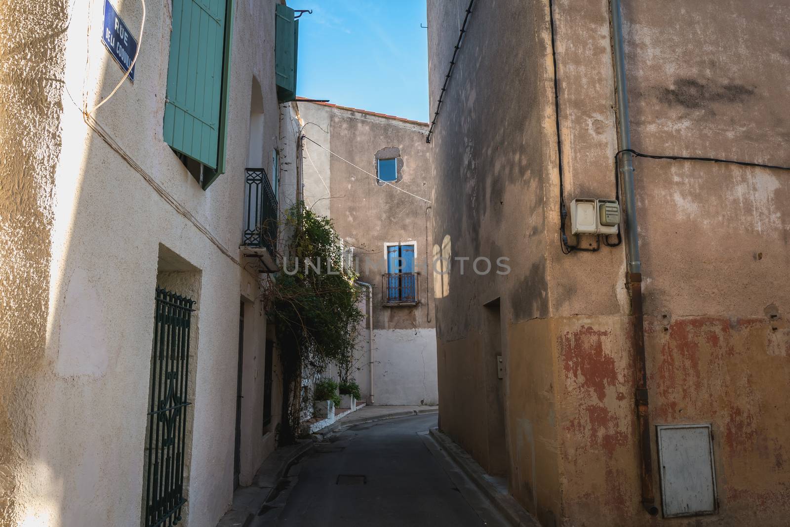 Marseillan, France - December 30, 2018: architectural detail of small typical townhouses in the historic town center of a small fishing port in the south of France on a winter day