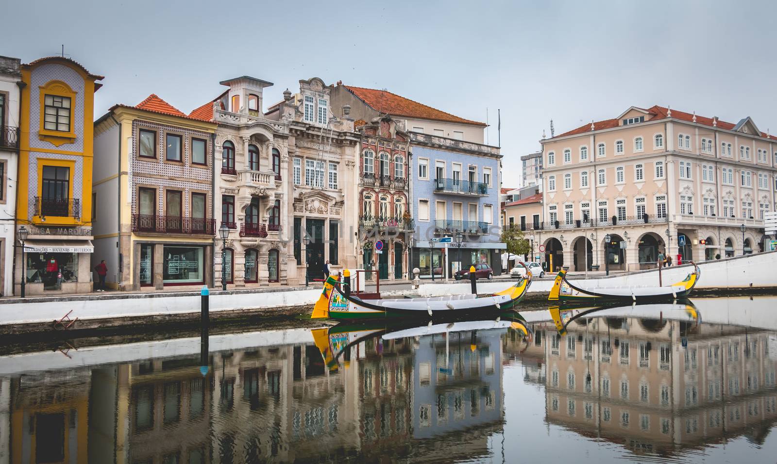 Tourists walk on famous Moliceiros of aveiro in Portugal by AtlanticEUROSTOXX