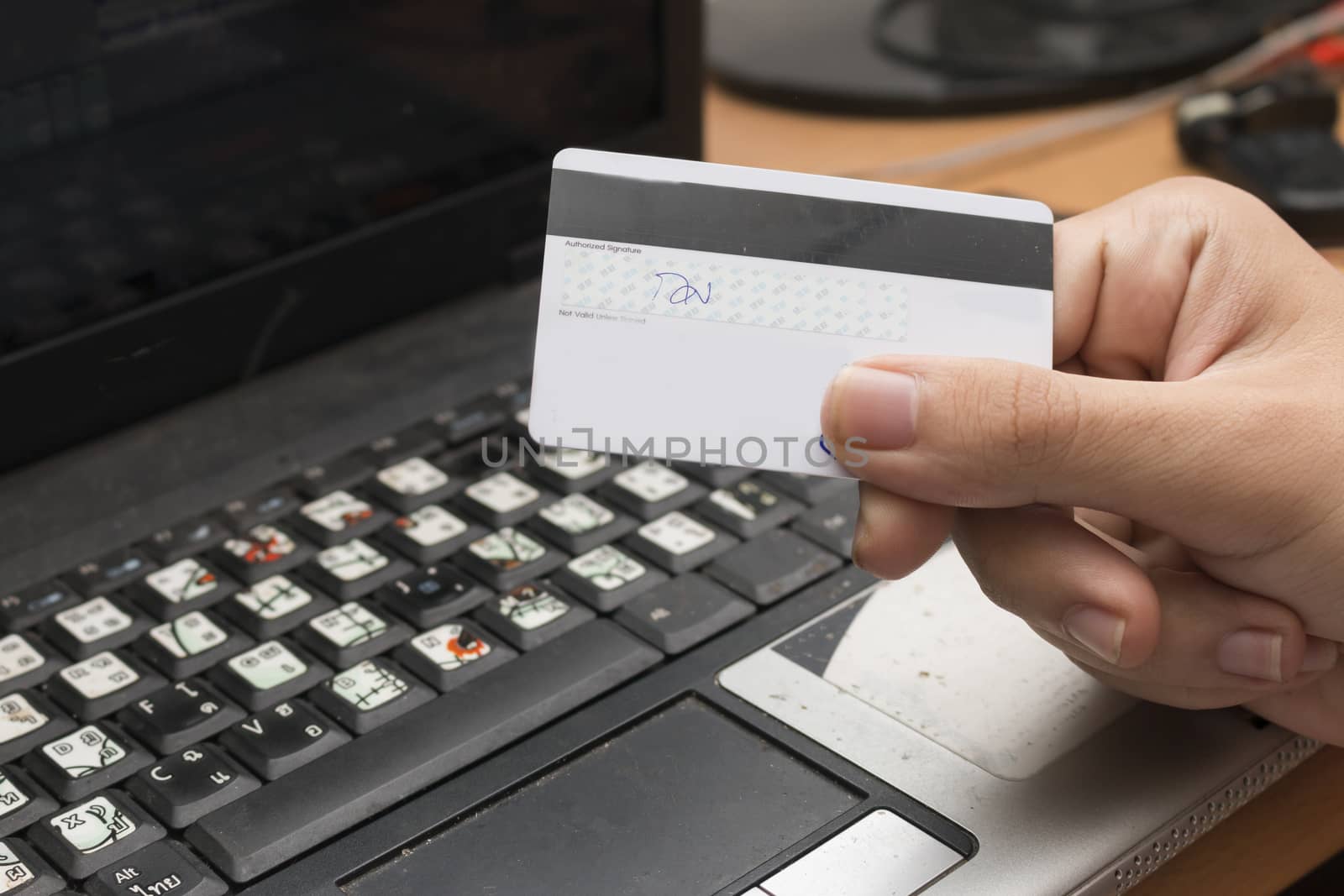 Hands holding credit card and using laptop. Online shopping,Game online