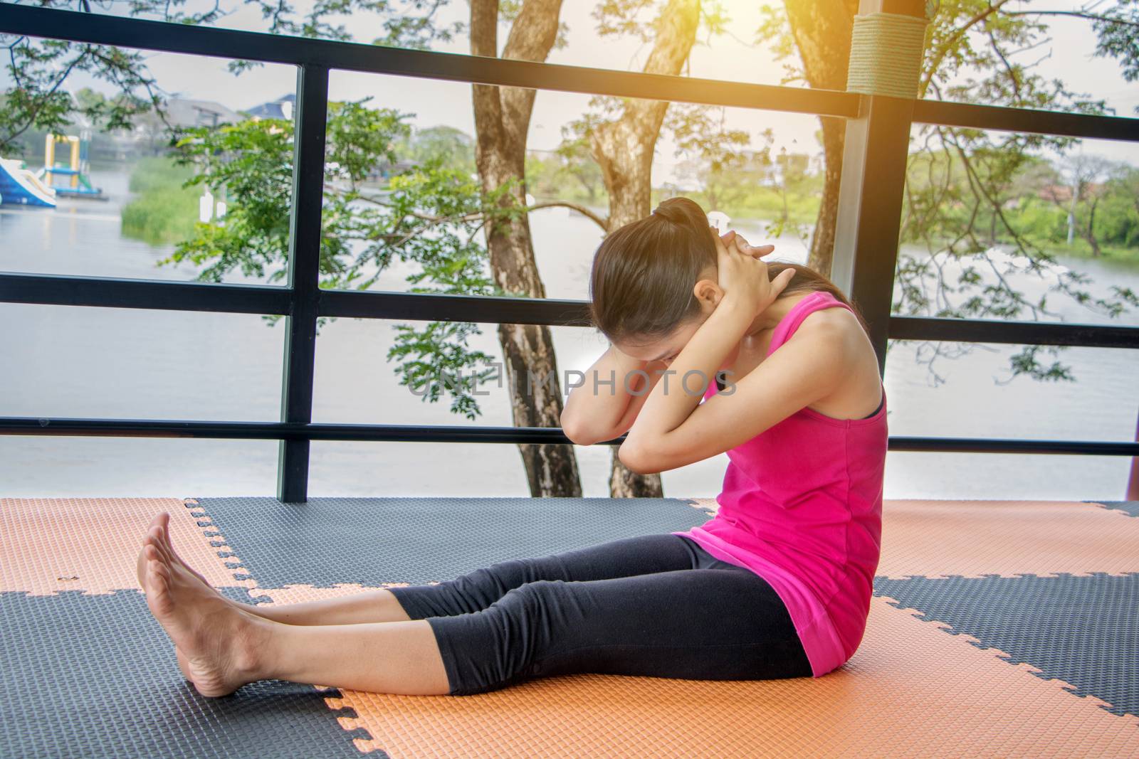 Asian women wearing pink shirts Exercise. by minamija