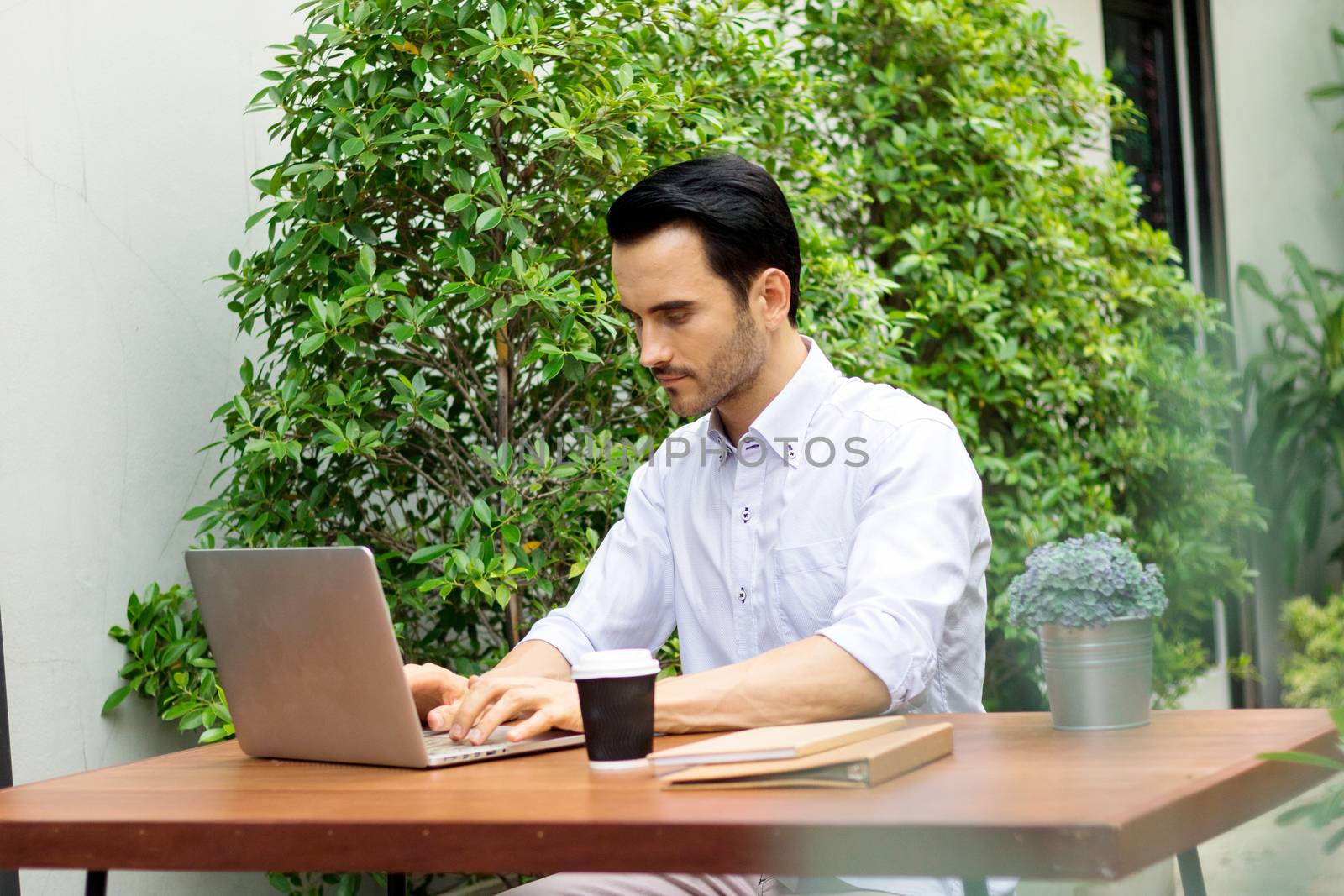 Young man working in the garden.