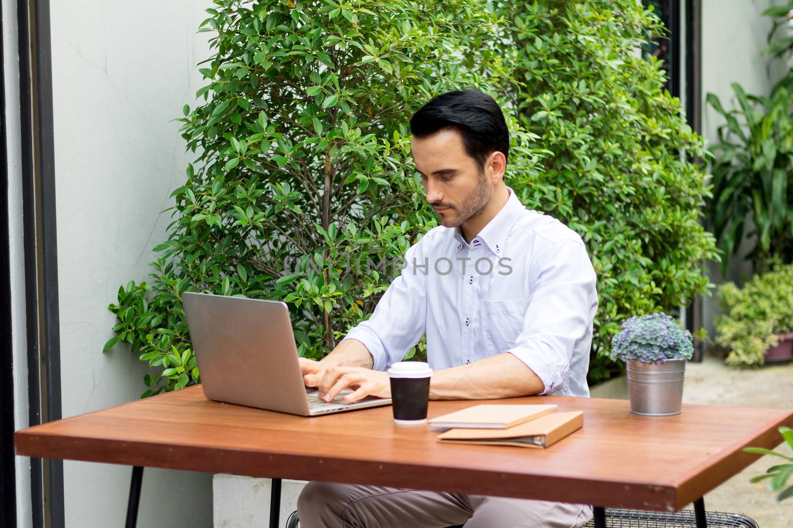 Young man working in the garden.