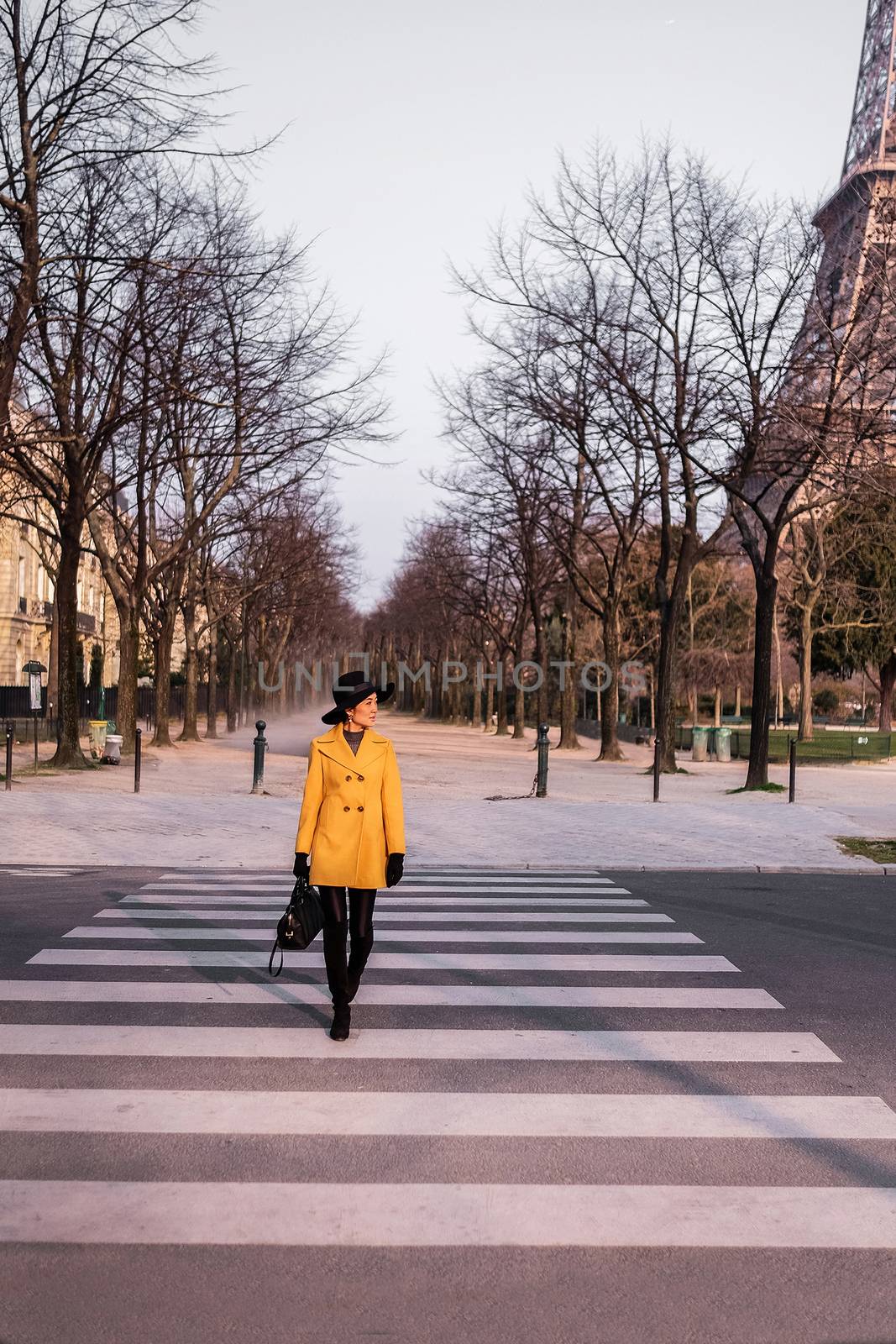 Beautiful girl crossing the street in paris,France by Surasak