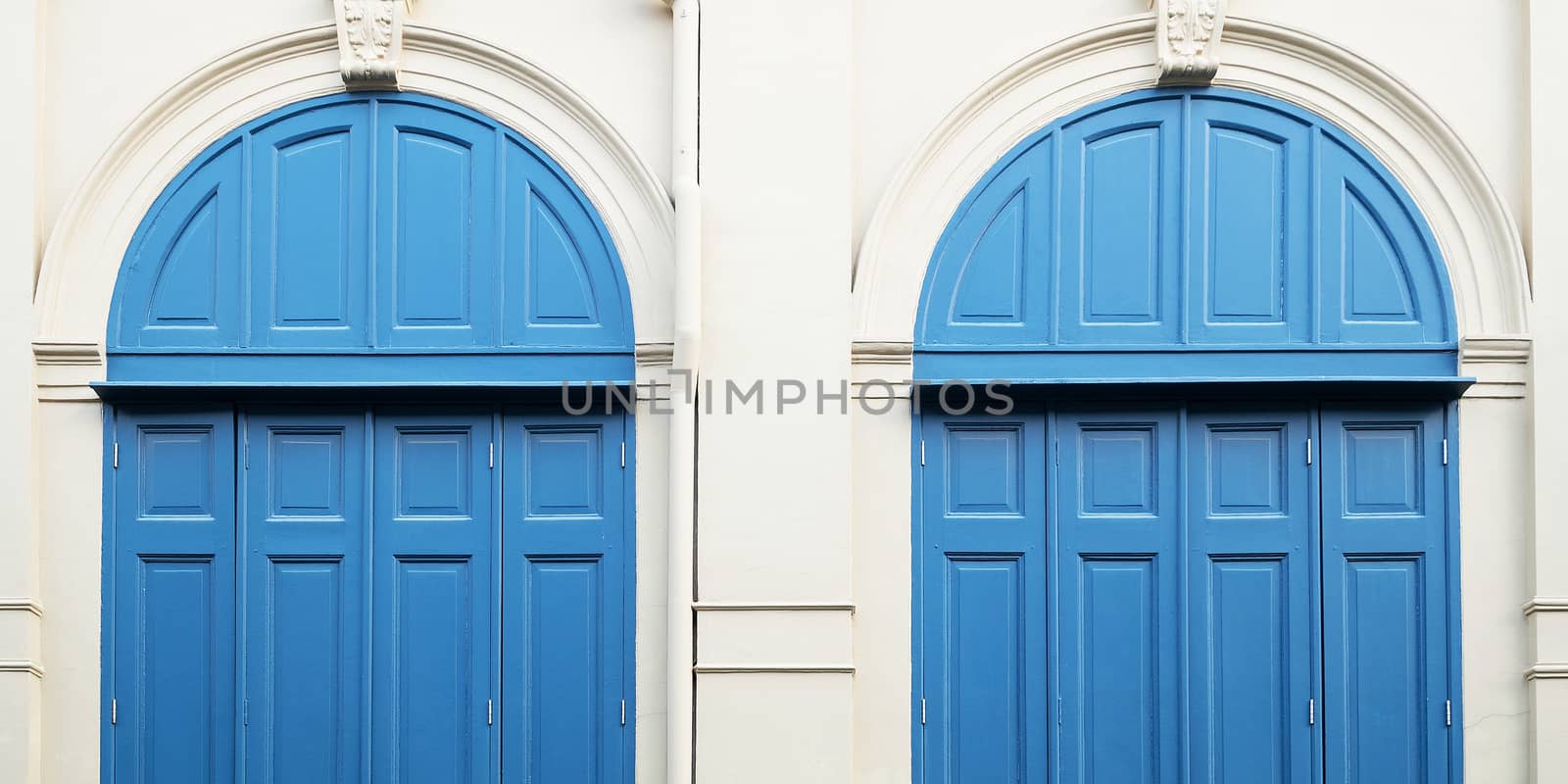 Blue door with wall  by Surasak