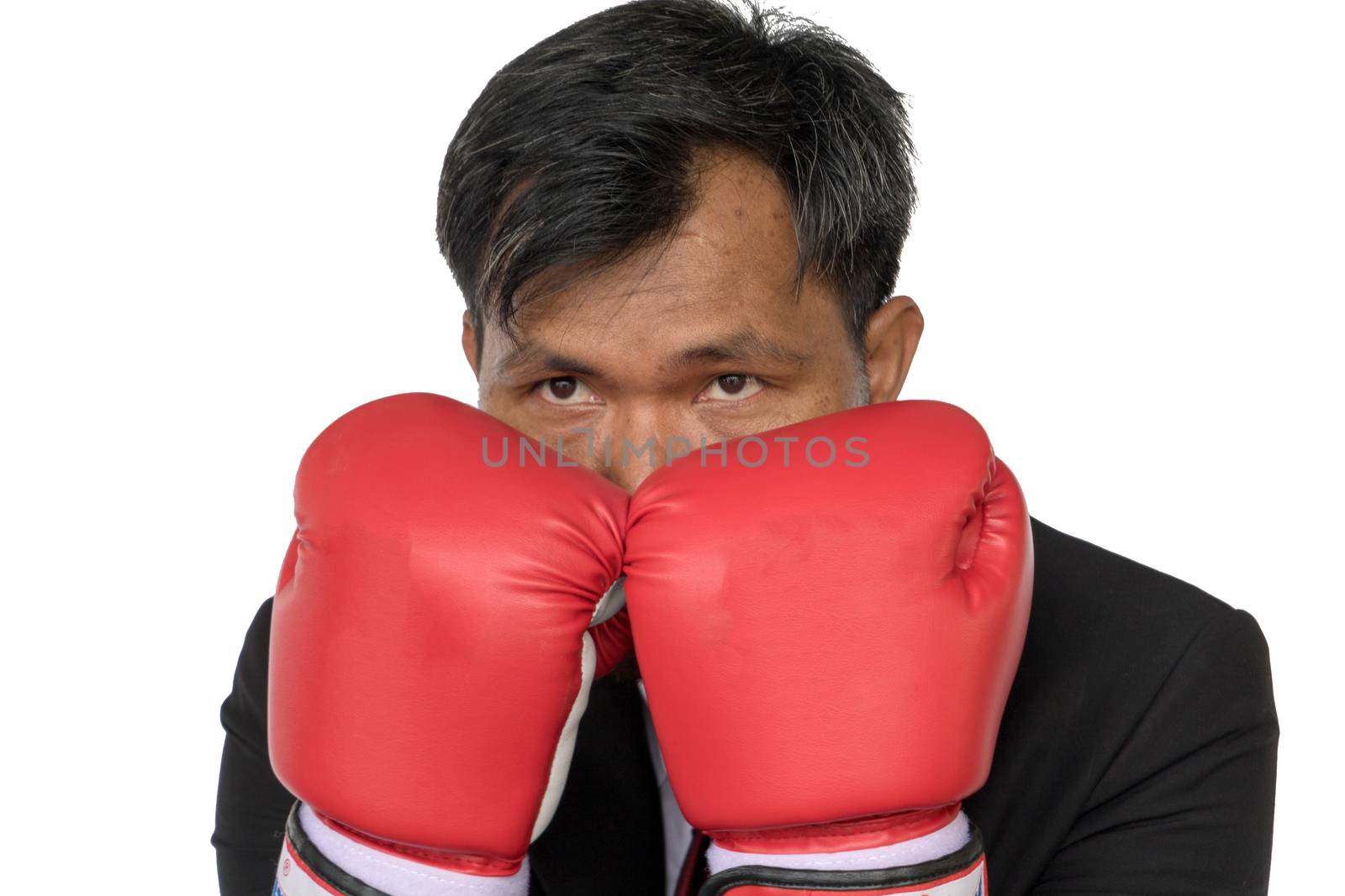 Young businessman wearing boxing gloves It shows that it is ready to fight the competition and problems in the future. Business Boxing concept.