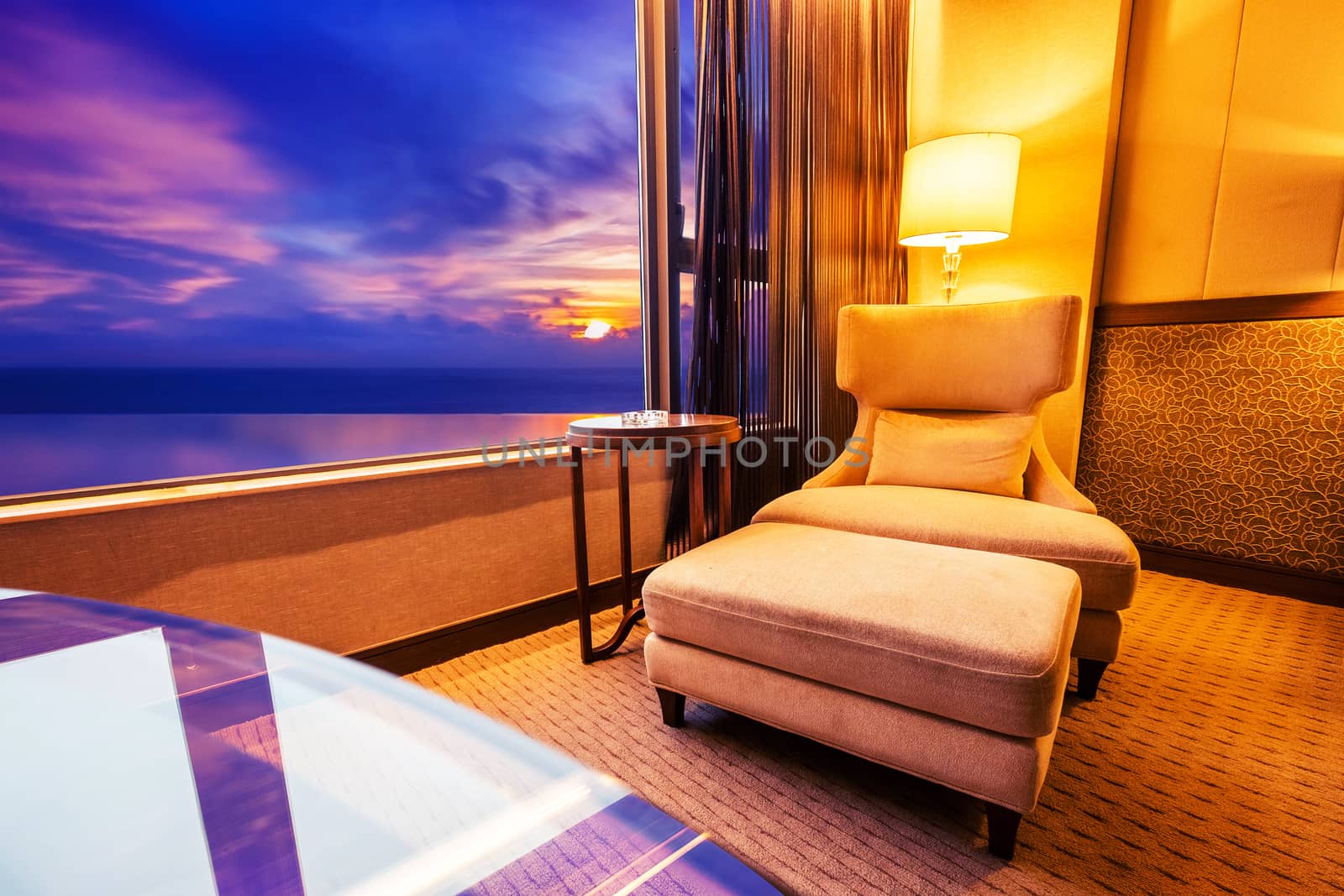 Blue room Sofa in living room and sunset sky by Surasak