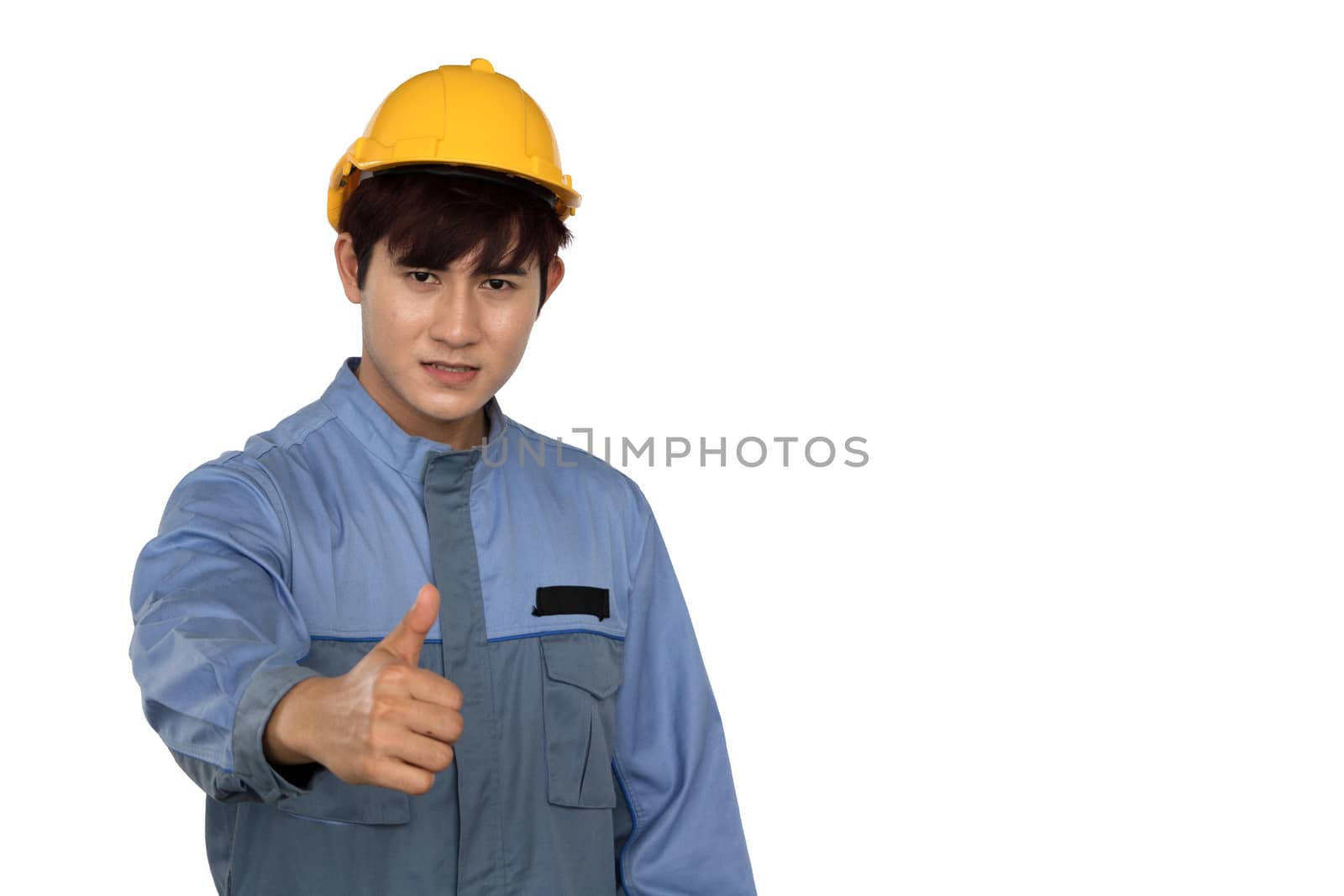Young Asian engineering Standing in yellow helmet.