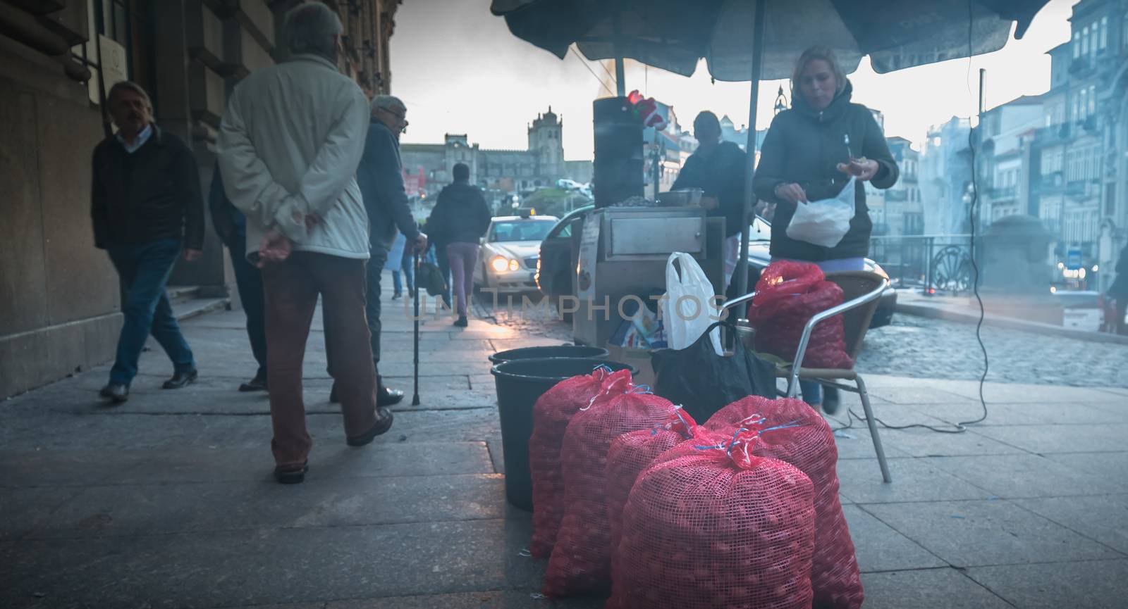 Street vendors of braised chestnuts in front of Sao Bento statio by AtlanticEUROSTOXX