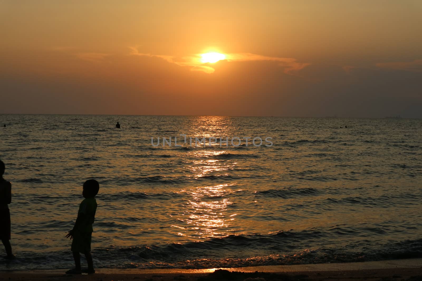 silhouette one kid  play on sea sunset by Darkfox