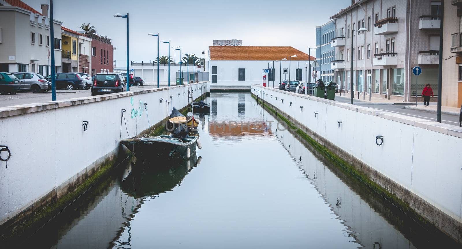 Aveiro, Portugal - May 7, 2018: Small boat docked on a canal in the city on a spring day