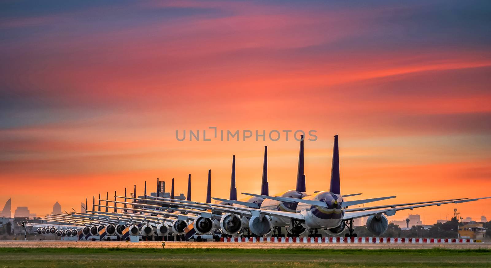 Commercial airplane parking at the airport are stopped effect by covid-19 pandemic around the world economic down crisis, Airplanes are parking at maintenance area because of COVID-19 travel alert