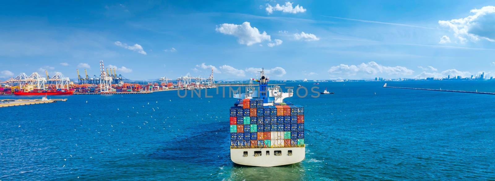 Aerial view container ship arriving in industrial terminal seaport, Global transport cargo ship logistic business import and export, Container cargo vessel industry freight shipping company commercial worldwide.