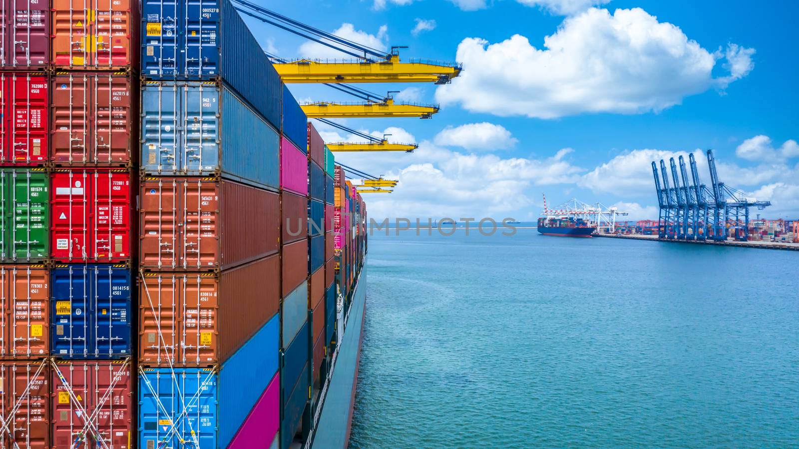 Container ship unloading in deep sea port, Global business logistic import export freight shipping transportation oversea worldwide container ship, Container vessel loading cargo cargo freight ship.