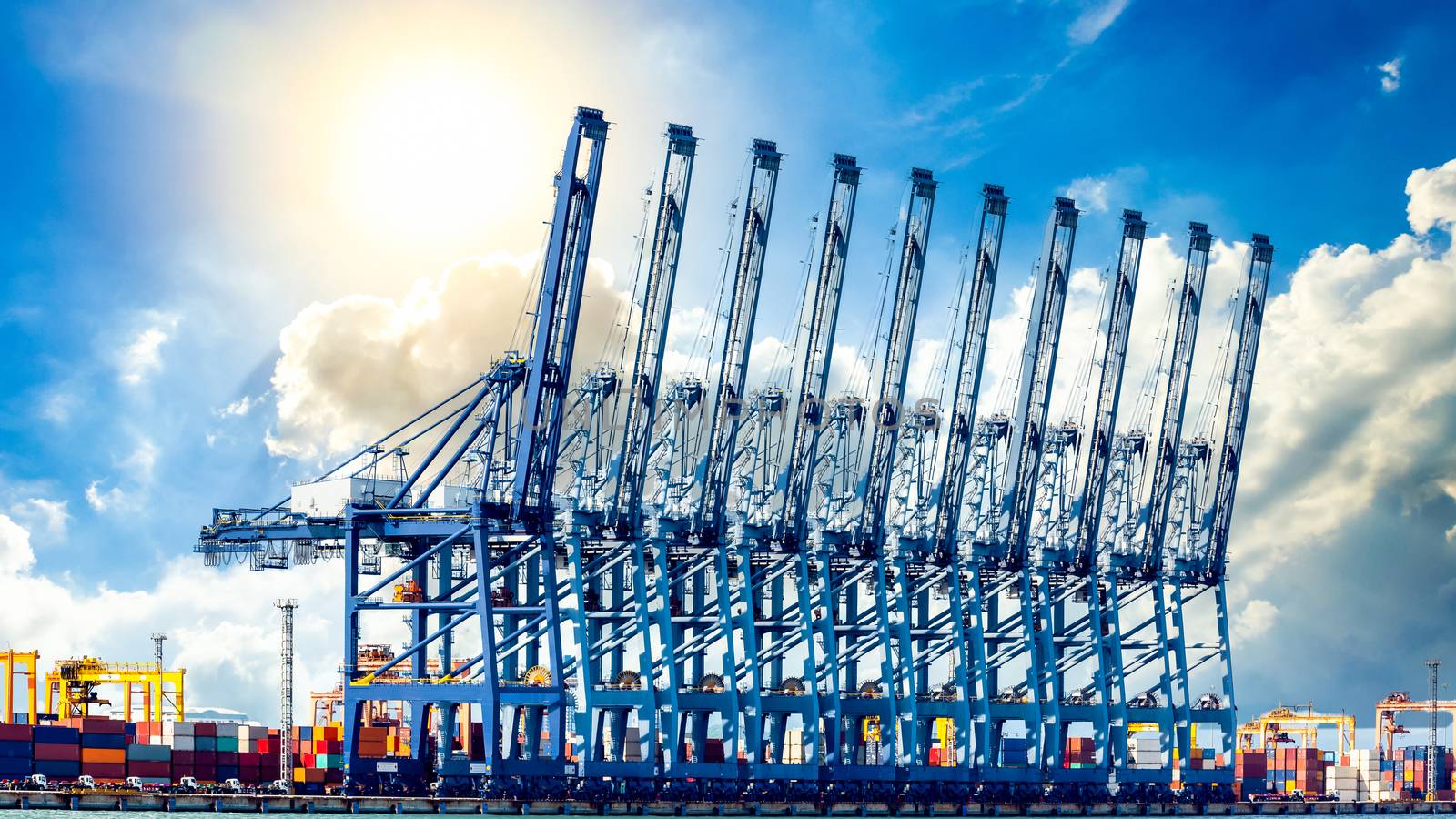 Harbor cargo cranes shipping port equipment, Industrial port crane, Logistics business huge cranes and containers, Cargo freight ship with industrial crane, Container ship in import export business.