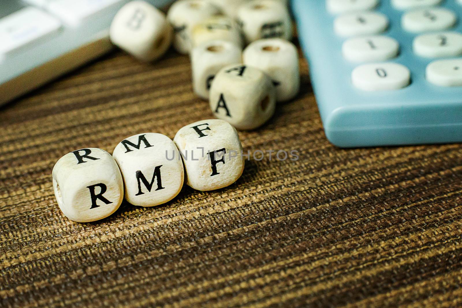 Text RMF on wooden cube image  for business content.