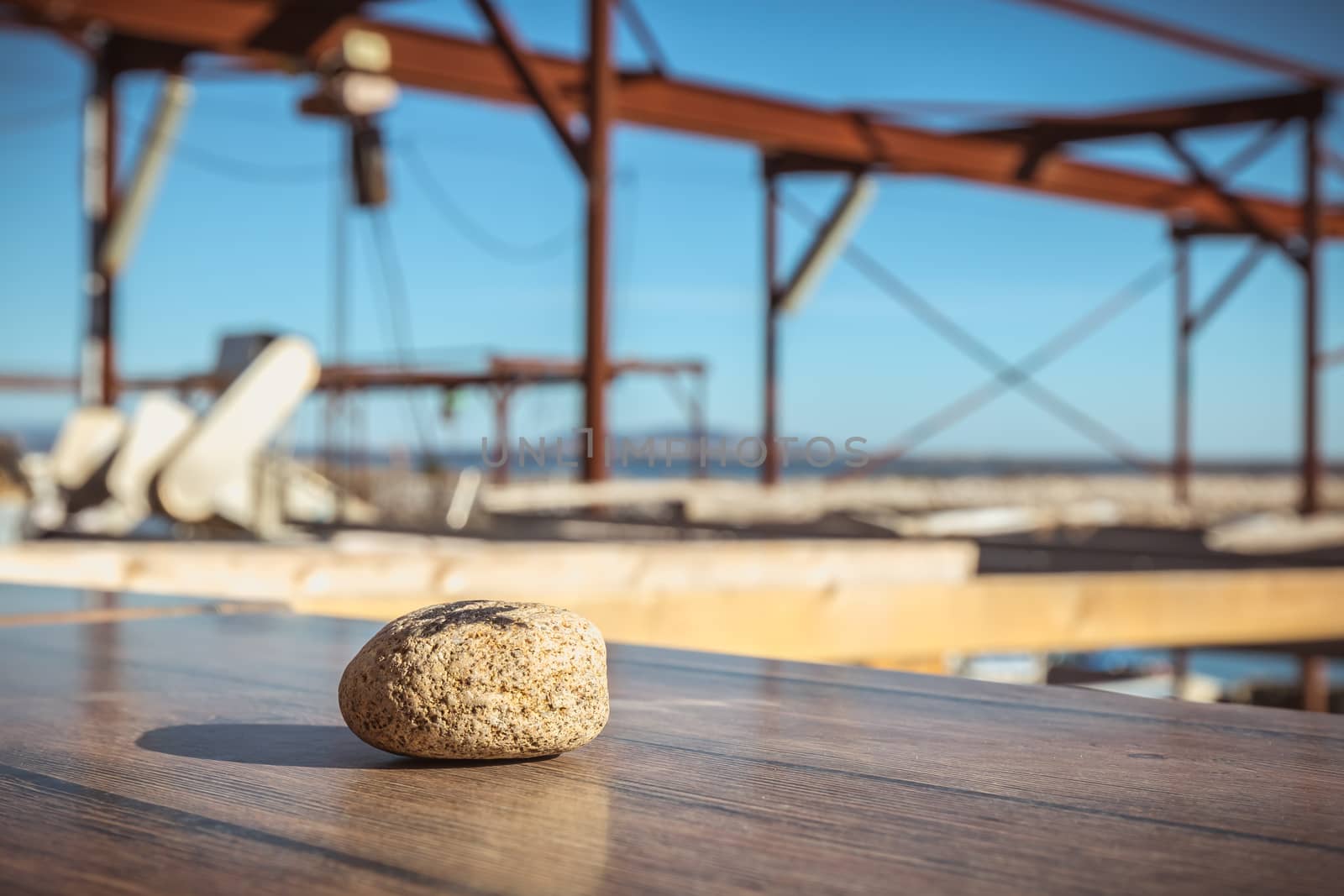 figure 4 written in felt on a small stone on the table of a restaurant