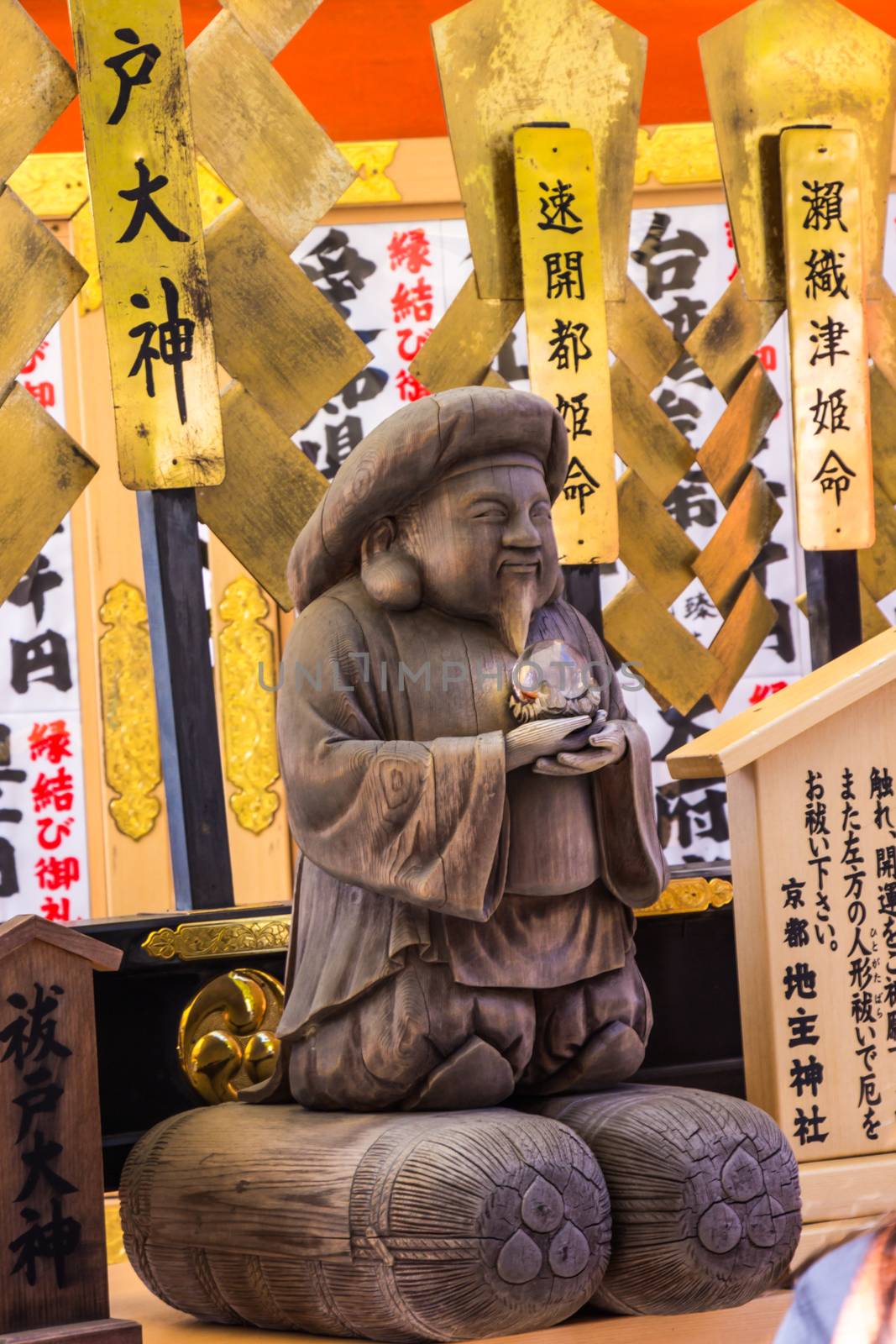 KYOTO, JAPAN - MARCH 12, 2018: Tourist at Kiyomizu-dera temple use your hands to touch God Harada Edo Okami for pray a god who purifies the body and mind in Kyoto, Japan.