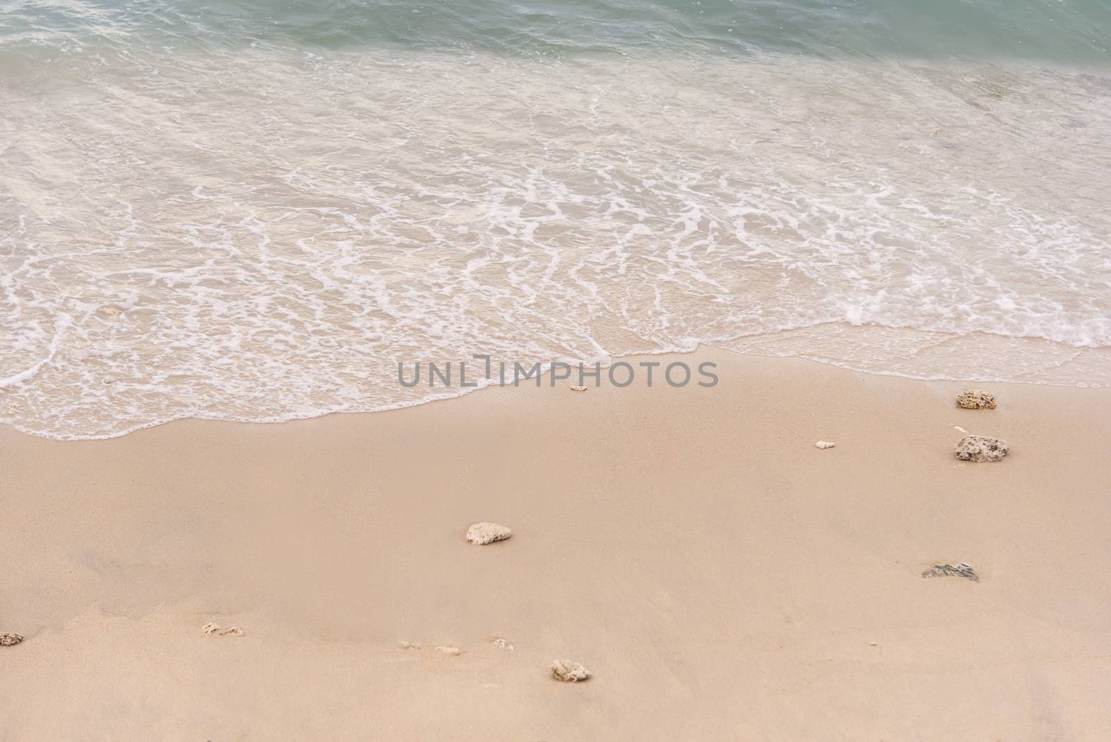 Soft wave on to the beach