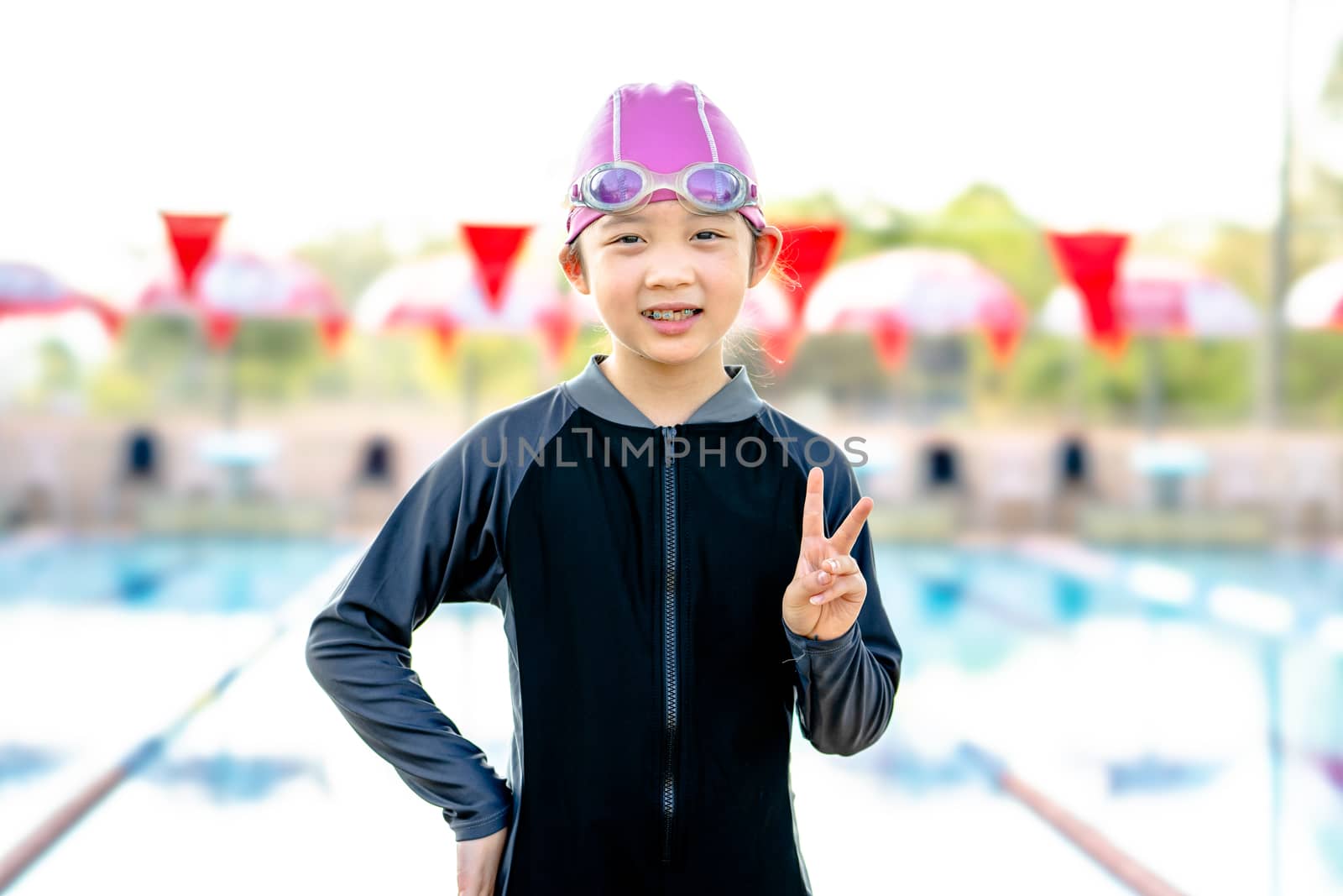 Asian Girl with Swimsuit Ready for Swimming Competition at Swimming Pool