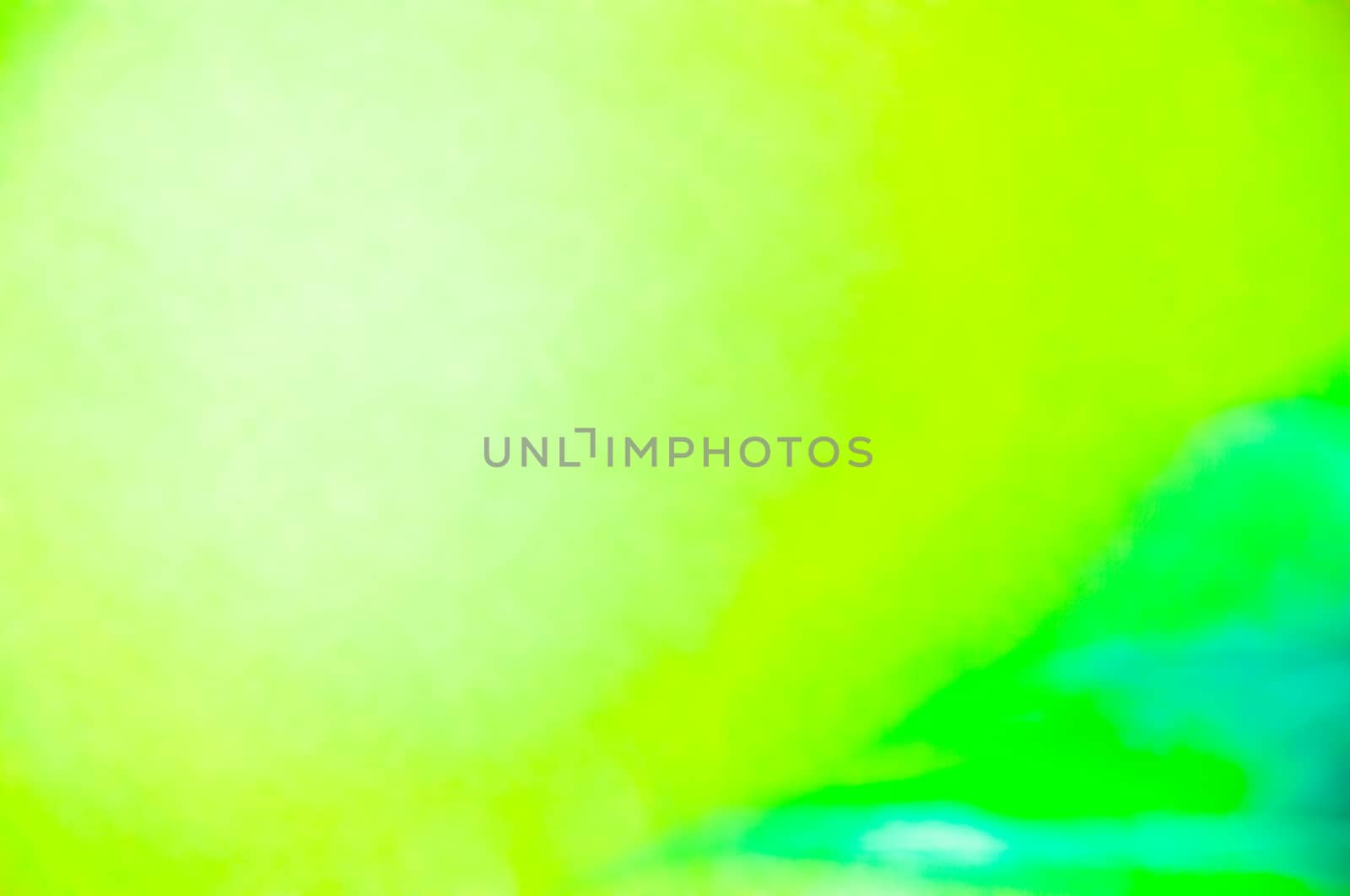 A green and light blue photographic abstract background