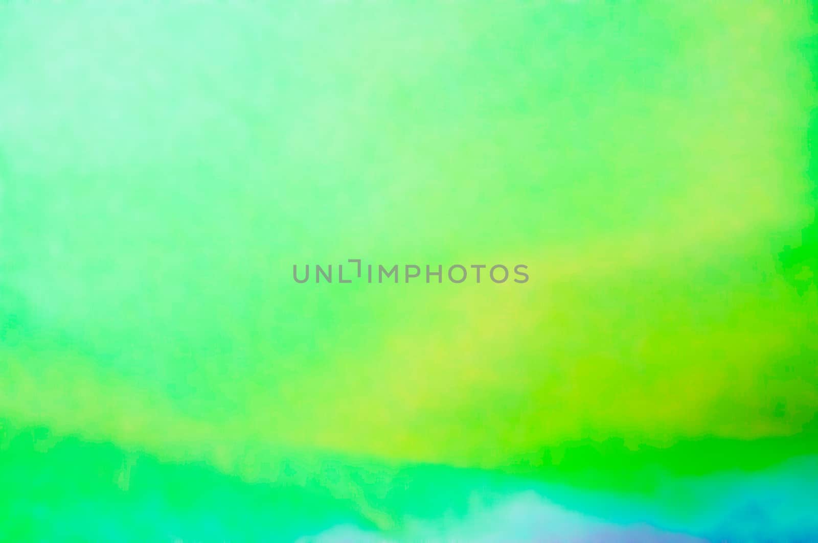 A green and light blue photographic abstract background