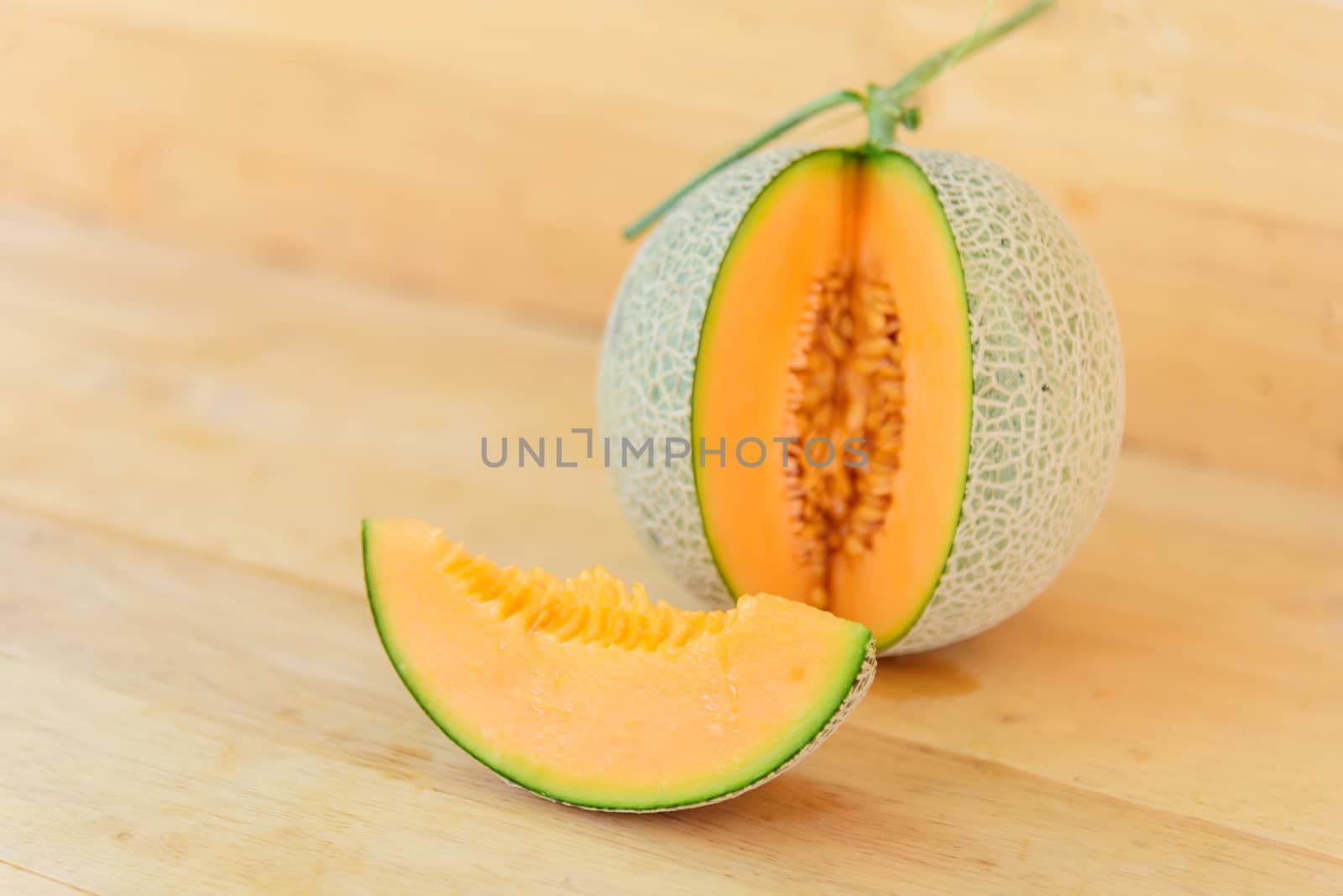 Fresh orange melon in greenhouse by rukawajung
