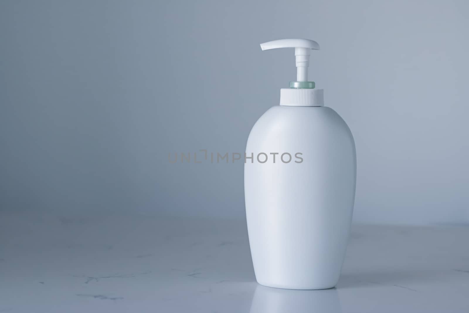 Blank label cosmetic container bottle as product mockup on gray background, hygiene and healthcare