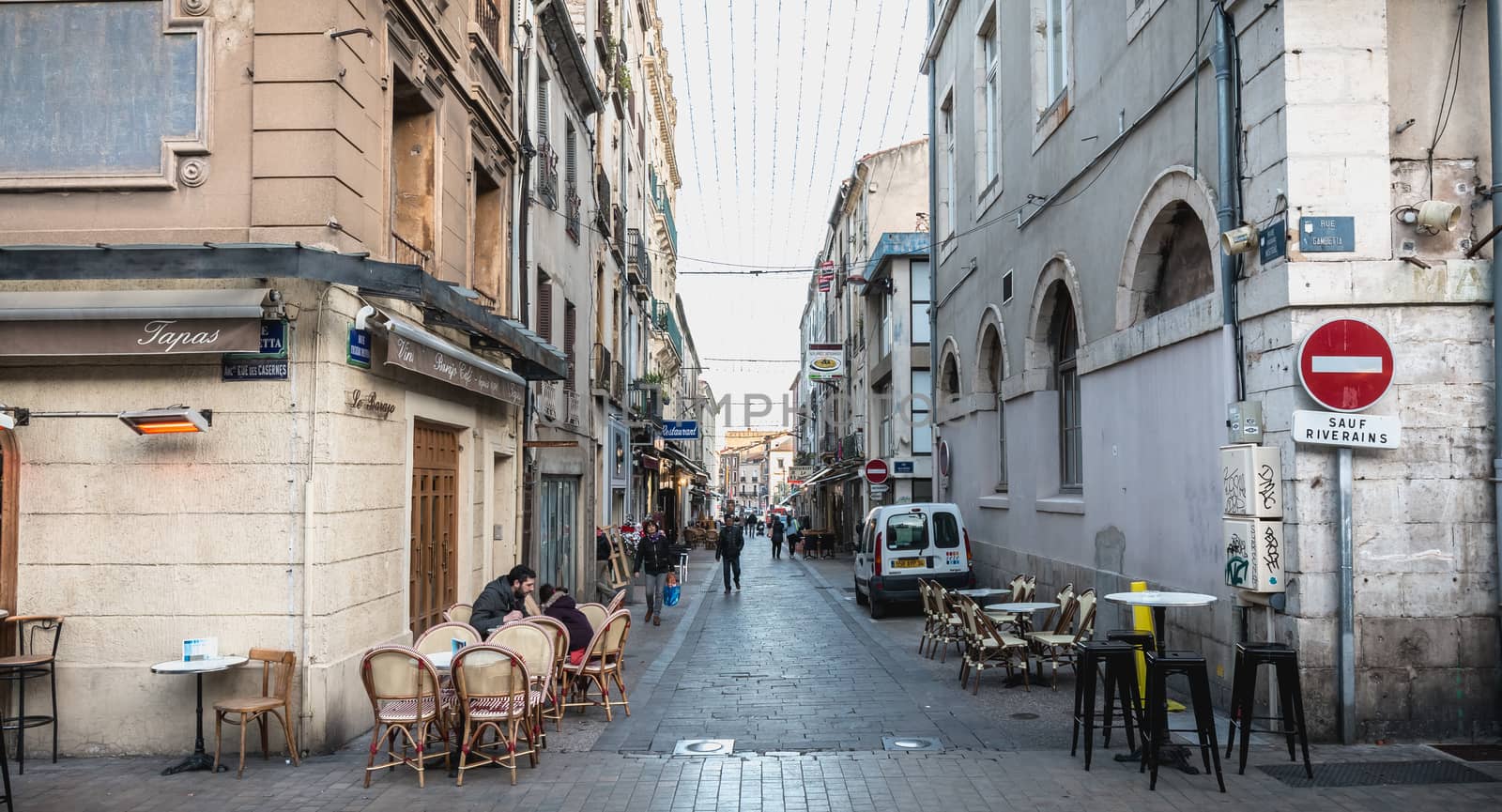 People walking in a shopping street in the historic city center  by AtlanticEUROSTOXX