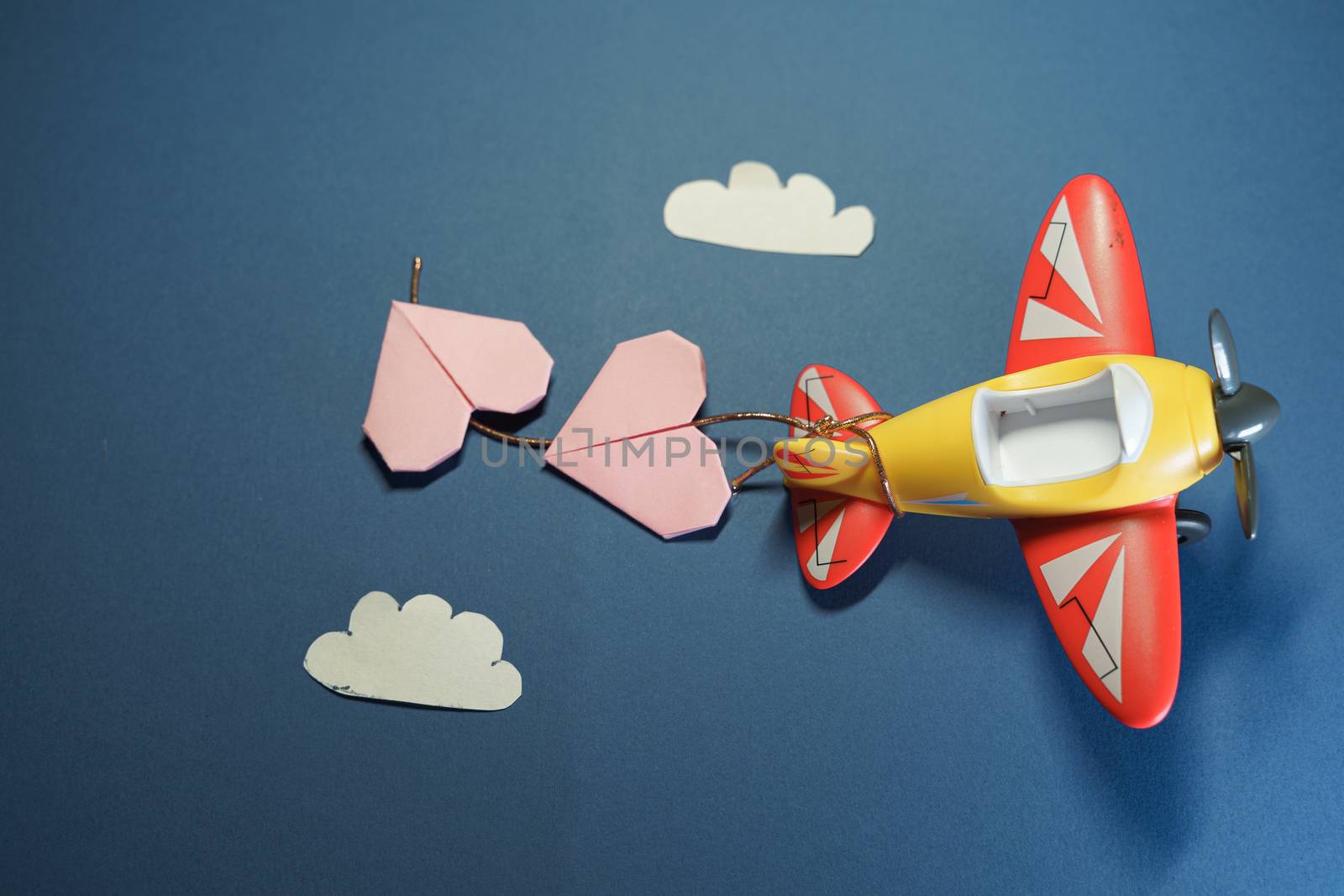 Airplane toy with origami paper pink hearts. by tanaonte