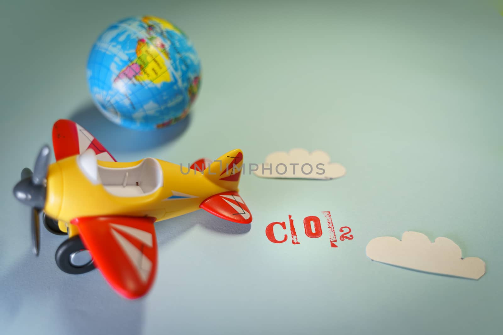 Airplane toy with CO2 word, global warming concept. by tanaonte