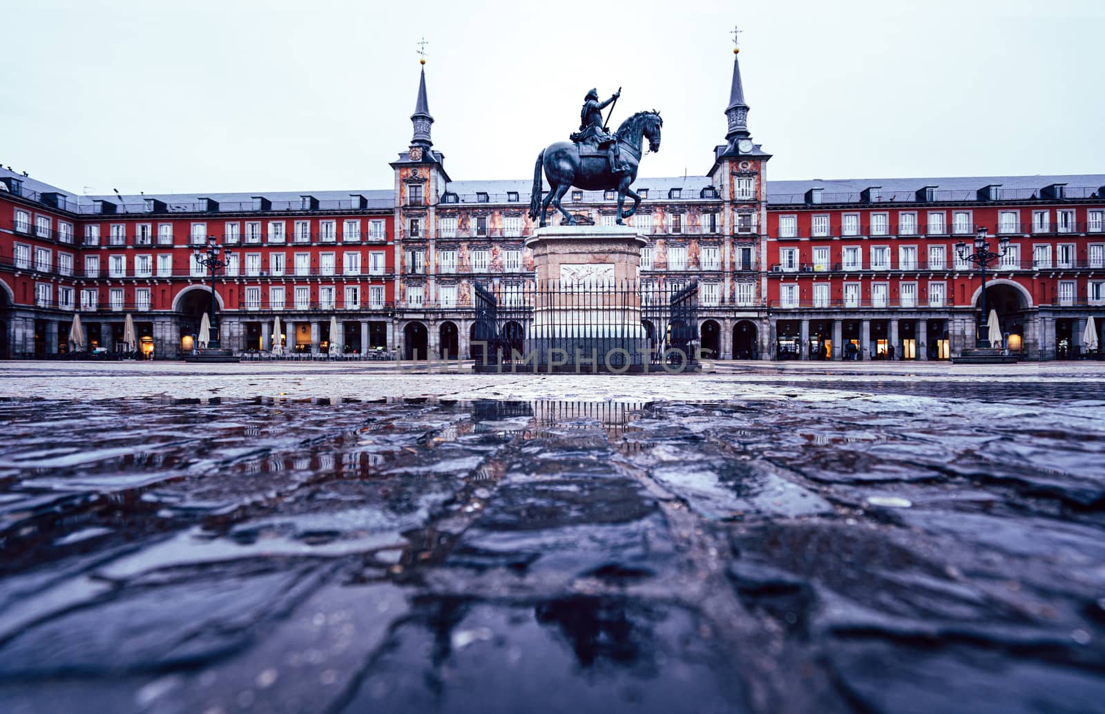 Plaza Mayor of Madrid after the storm, reflected on the ground.