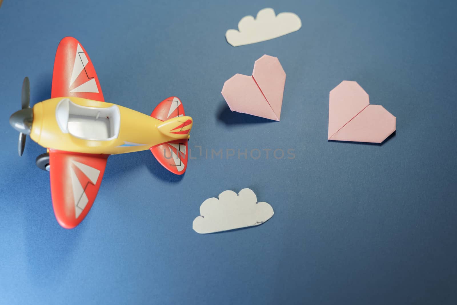 Airplane toy with origami paper pink hearts. by tanaonte