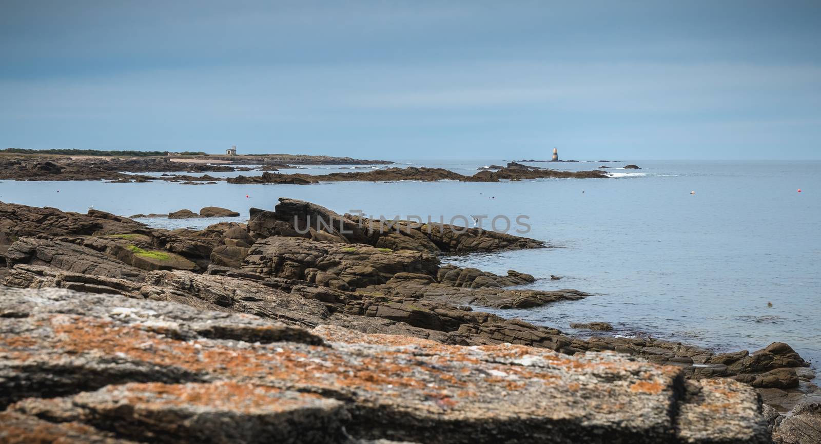 remnant of a foghorn, a semaphore and a boat anchor at Pointe du But on the wild coast of Yeu island, France