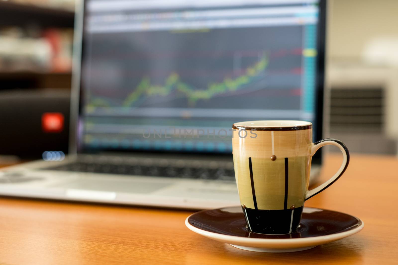 Working Time in Stock Market and with a cup of Coffee and mobile phone on the table