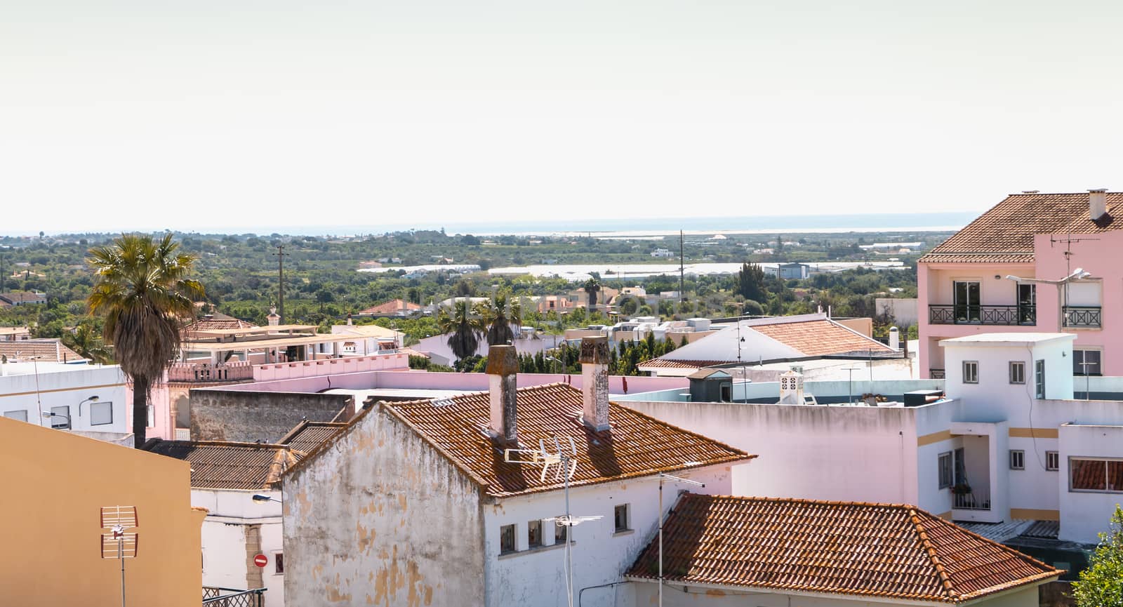Moncarapacho, Portugal - May 4, 2018: view over the roofs of houses with typical architecture on a spring day