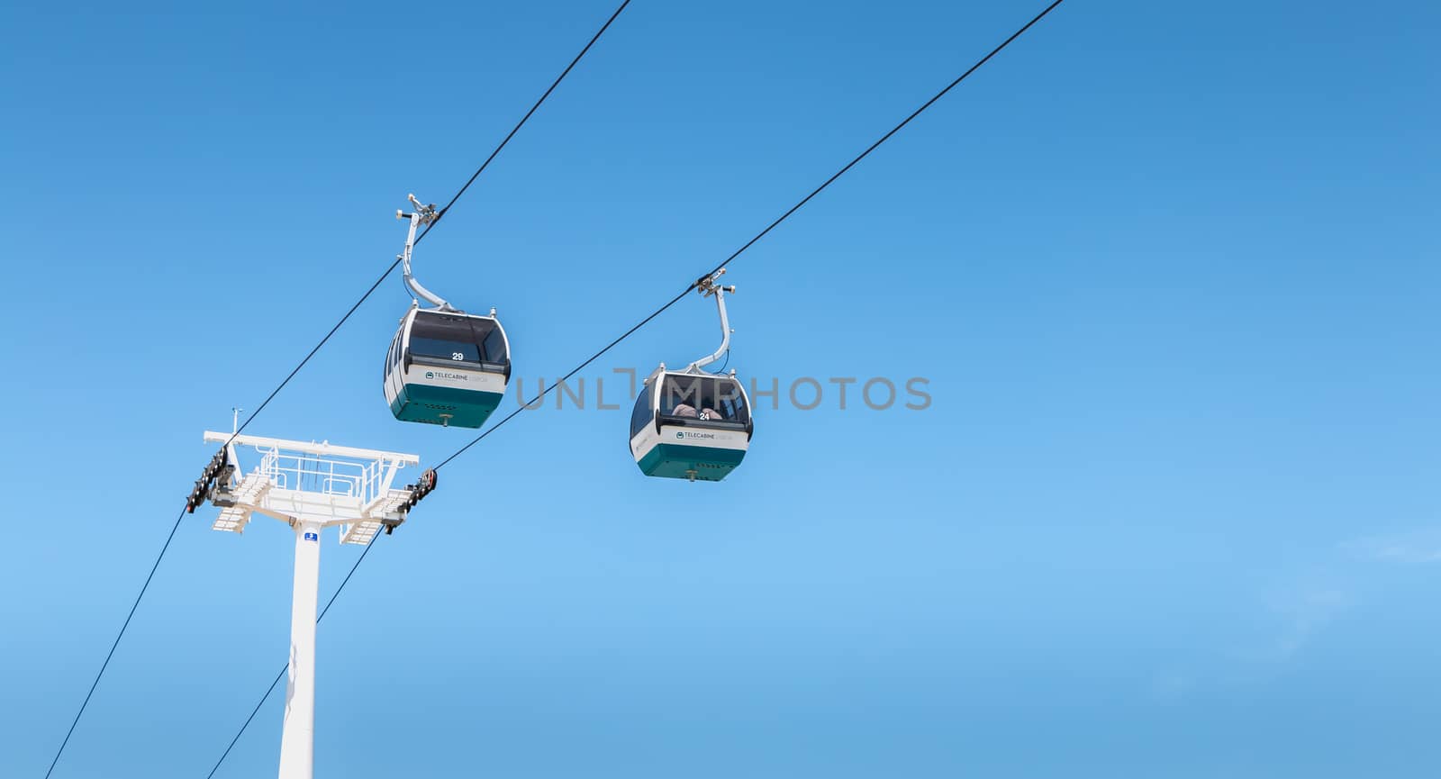 Lisbon, Portugal - May 7, 2018: Telecabine Lisboa at Park of Nations (Parque das Nacoes). Cable car in the modern district of Lisbon over the Tagus river on a spring day