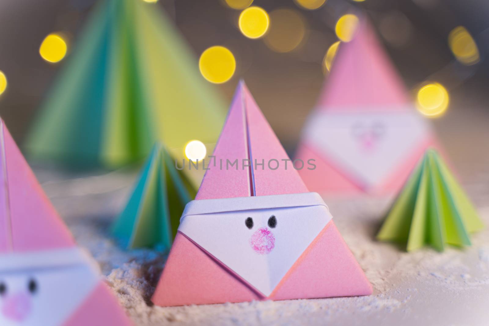 Origami Xmas scene with Santa claus and crhistmas trees in paper craft by tanaonte