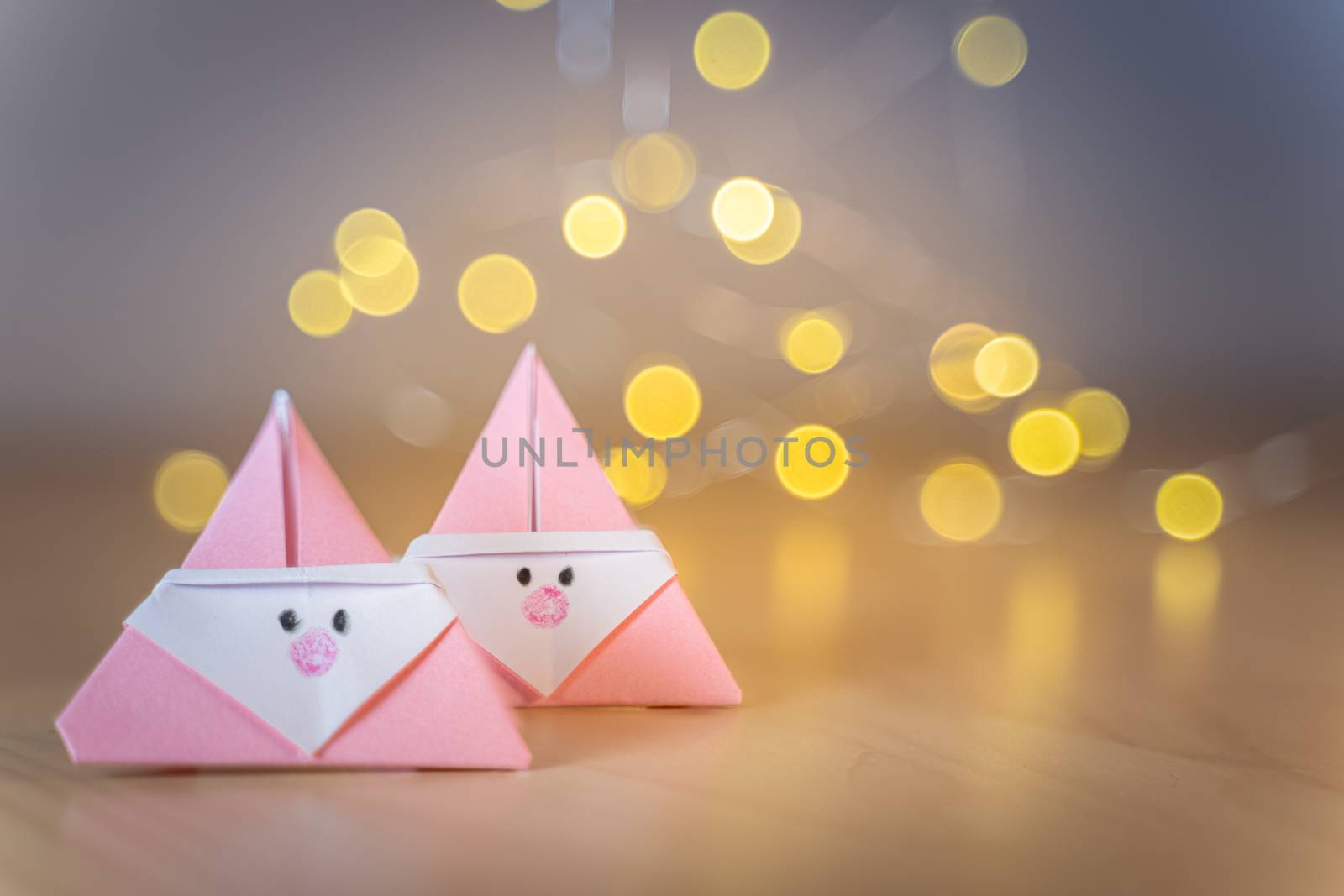 Origami Xmas scene with Santa claus and bokeh lights by tanaonte