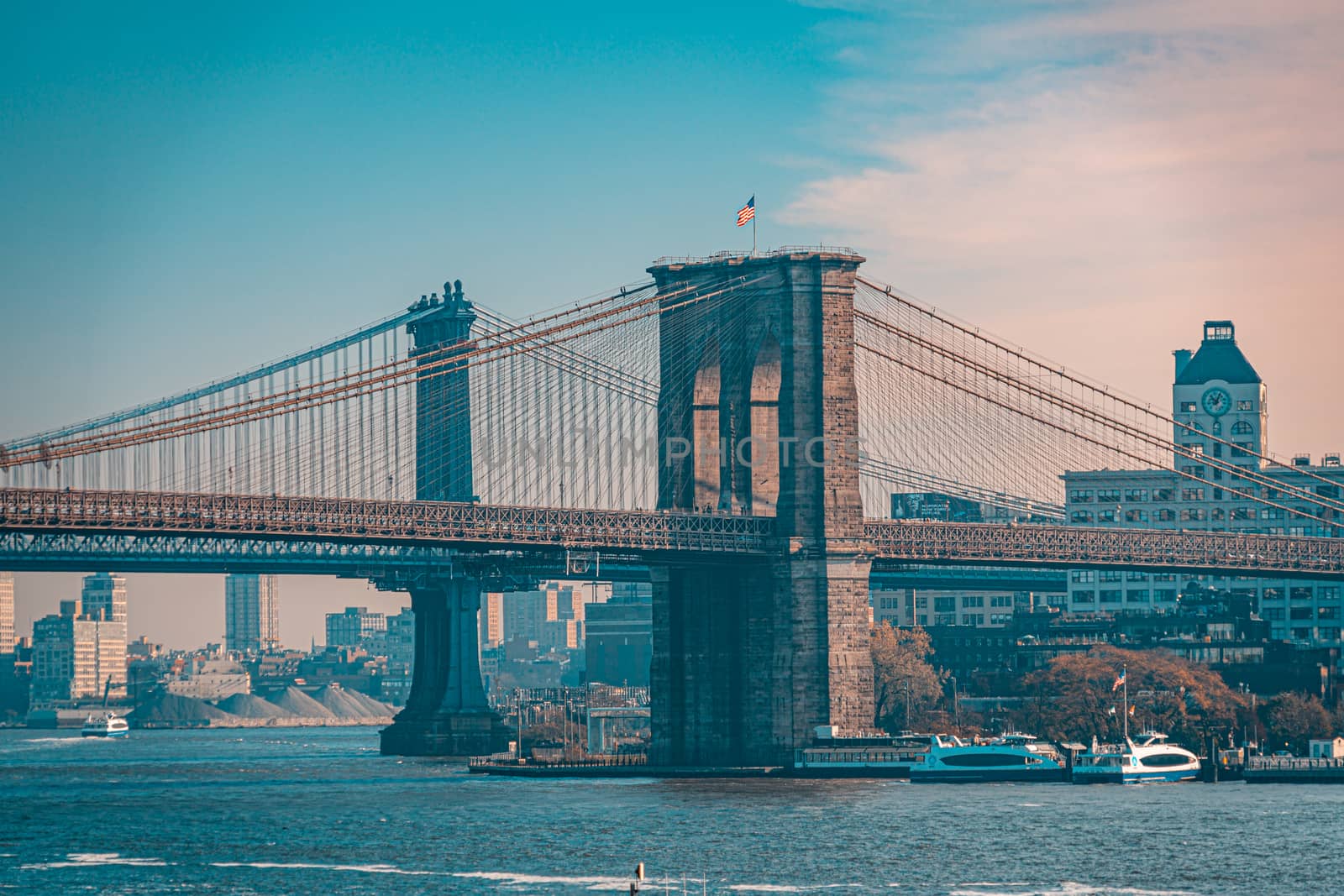 Brooklyn bridge in New York on bright summer day by tanaonte