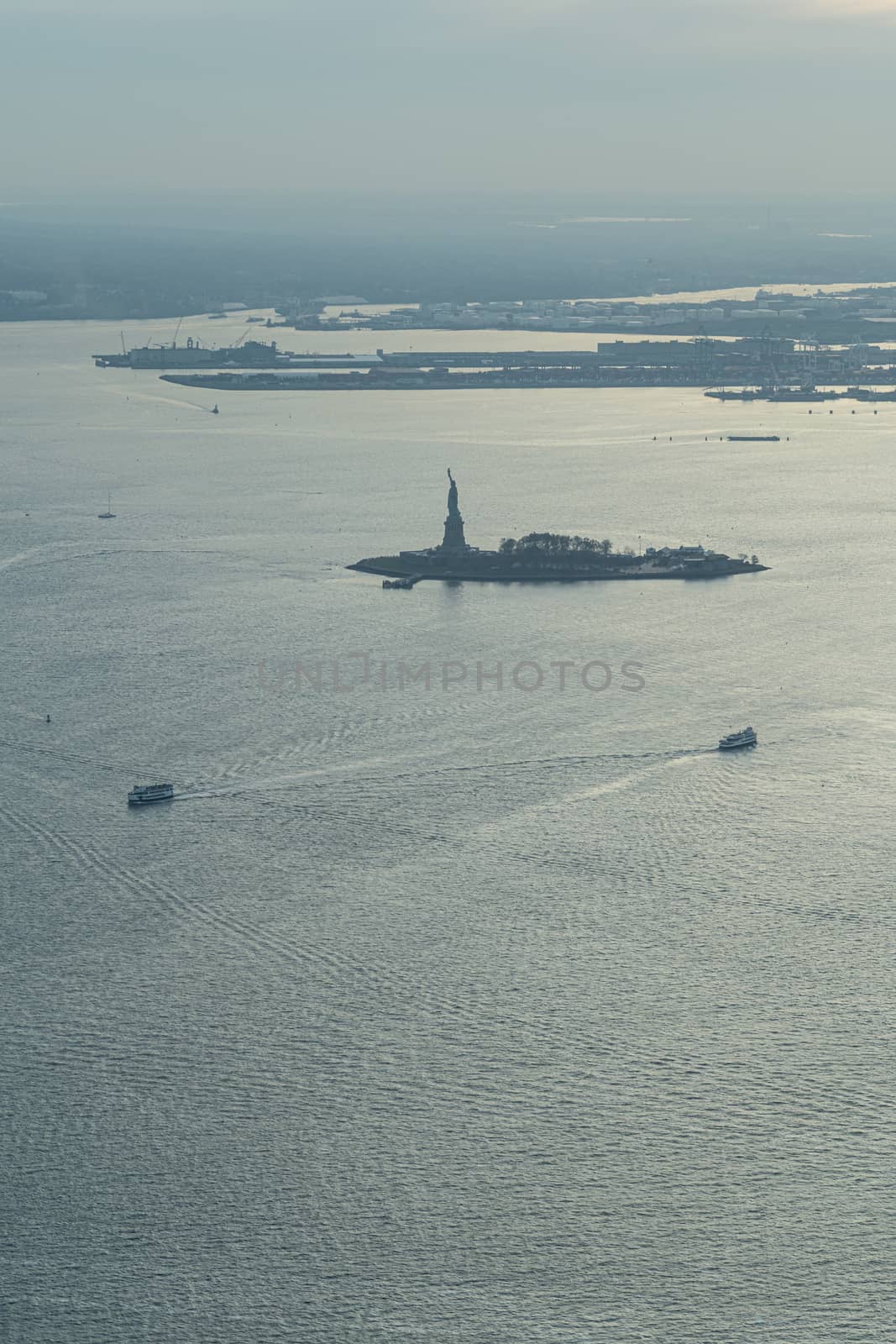 Statue of Liberty aerial photo at blue hour by tanaonte
