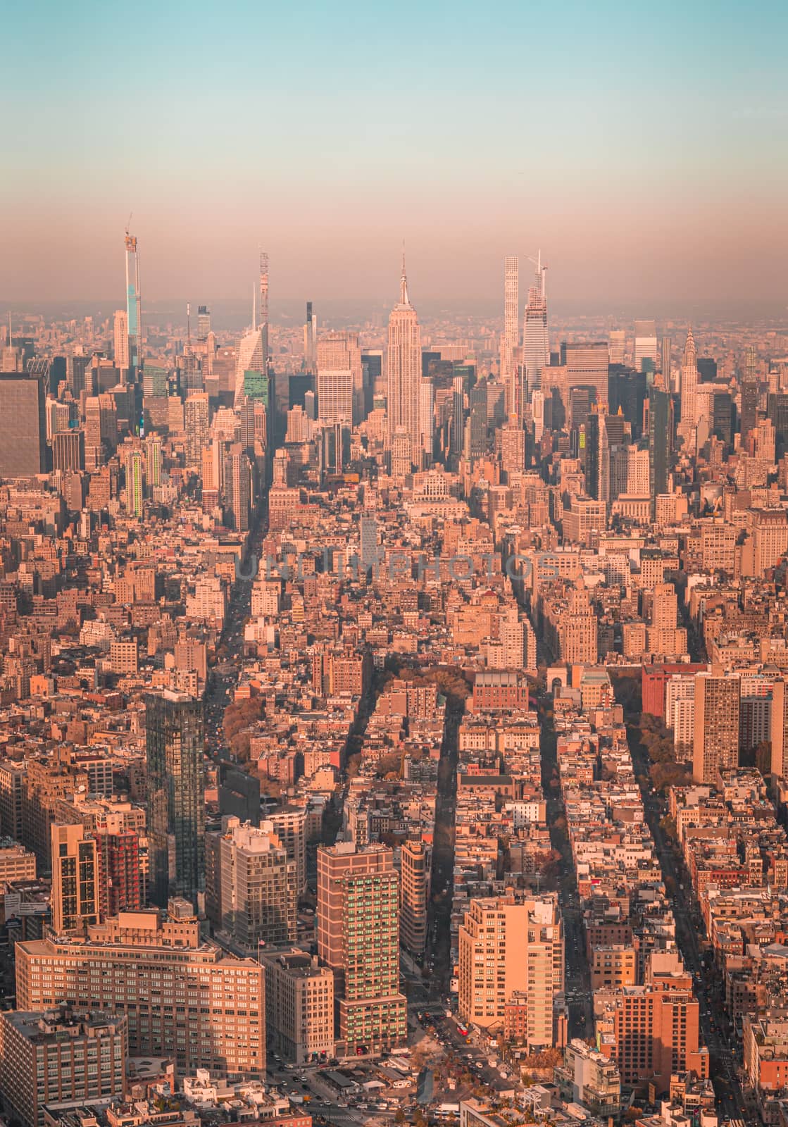 Sunset aerial view of New York City midtown Manhattan towards uptown. by tanaonte
