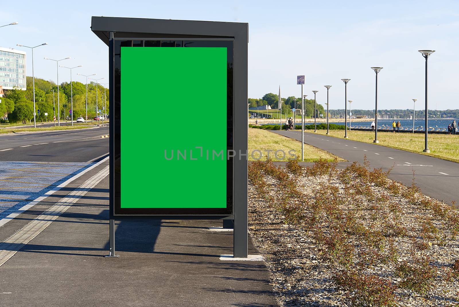 glass bus stop by the sea, with a chroma key advertising space. Blank billboard and outdoor advertising. Chroma key Mockup poster outside. Tallinn, Estonia. by PhotoTime