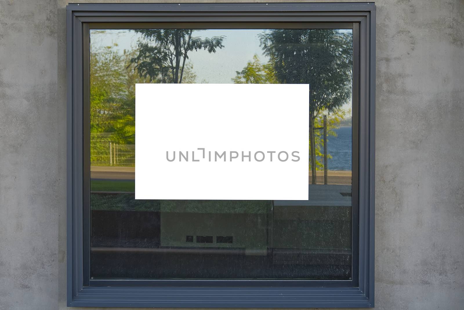 white advertising sticker on the window. well suited for real estate listings. Blank billboard and outdoor advertising. Mockup poster outside