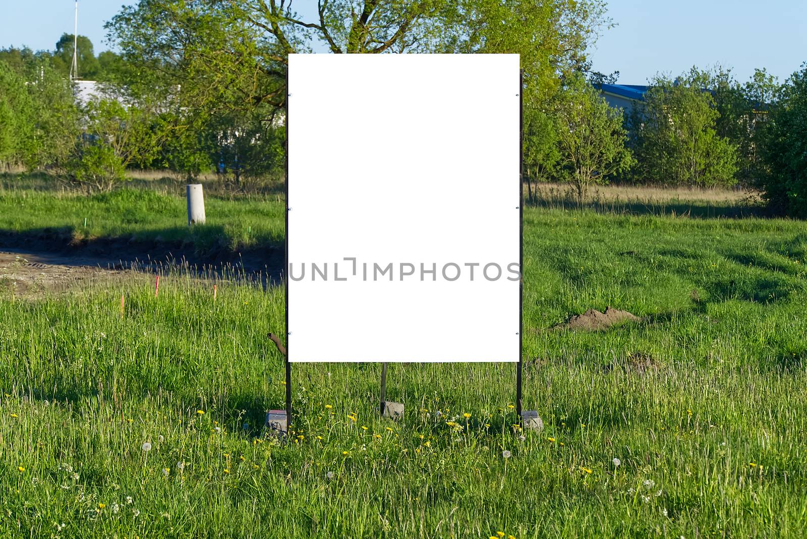 billboard on a background of green nature. suitable for advertising. Blank billboard and outdoor advertising. Mockup poster outside. by PhotoTime