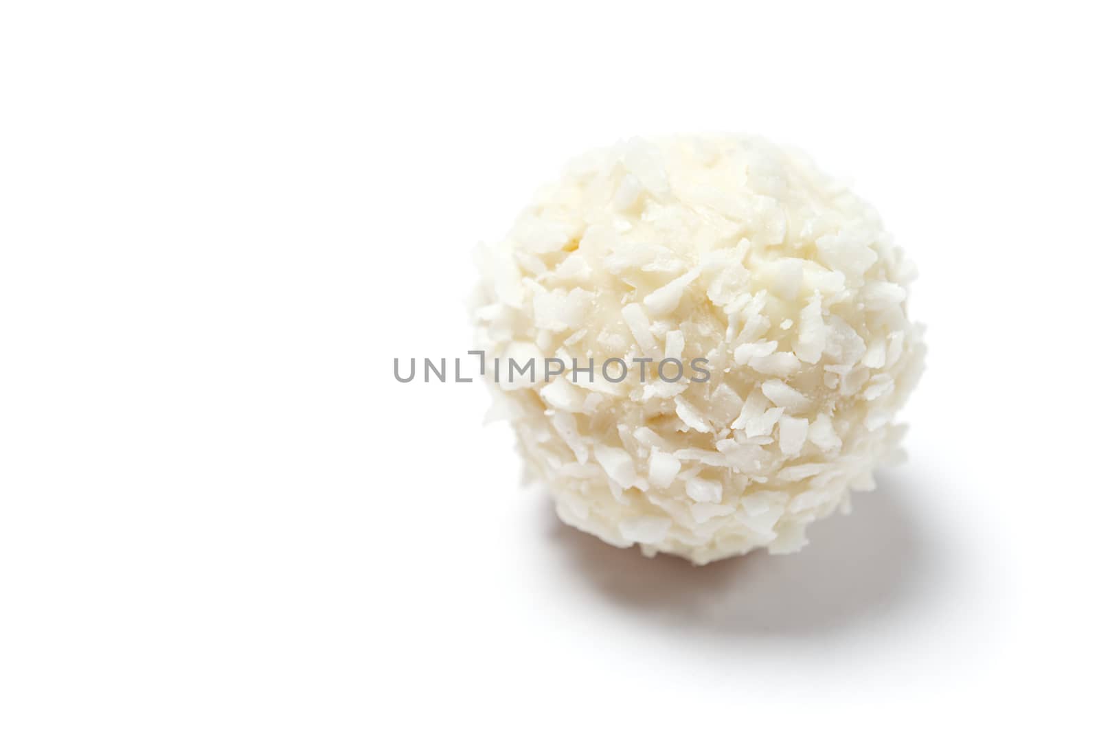 Homemade White Candy With Coconut Topping On White Background. copy space