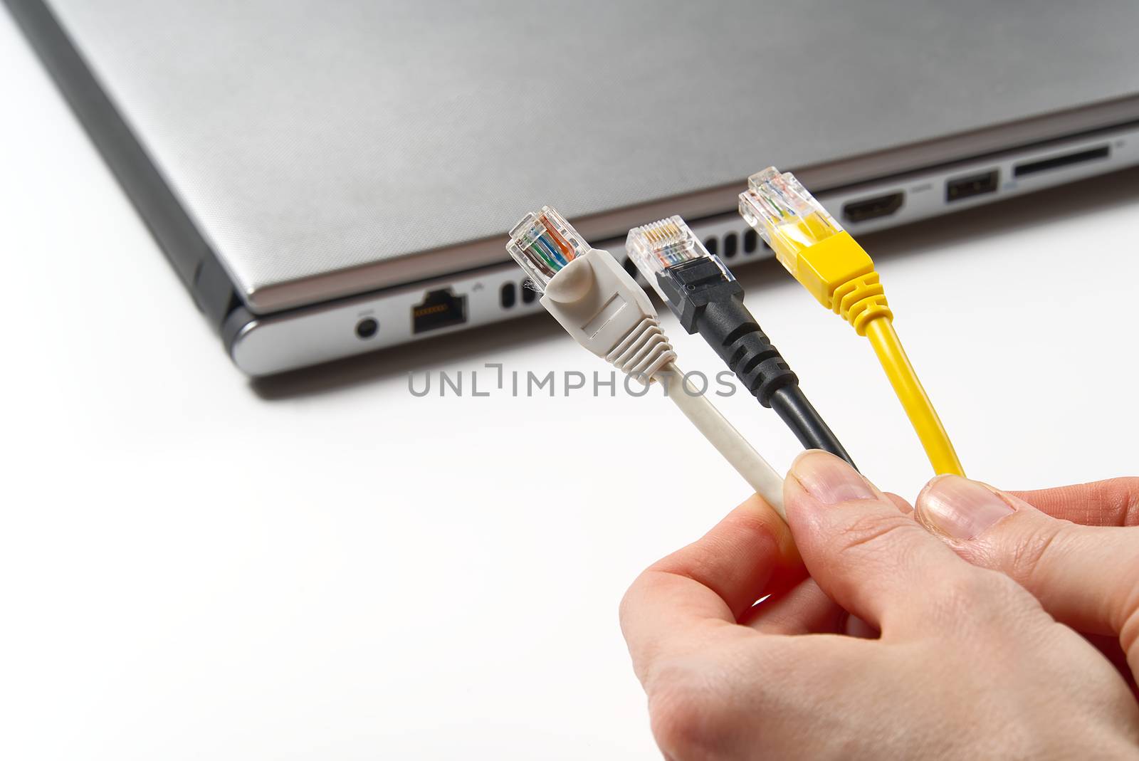hand holds wires with high speed internet access. Internet technologies of the future. connect to the Internet every home to work from home. wires cat5 cat6
