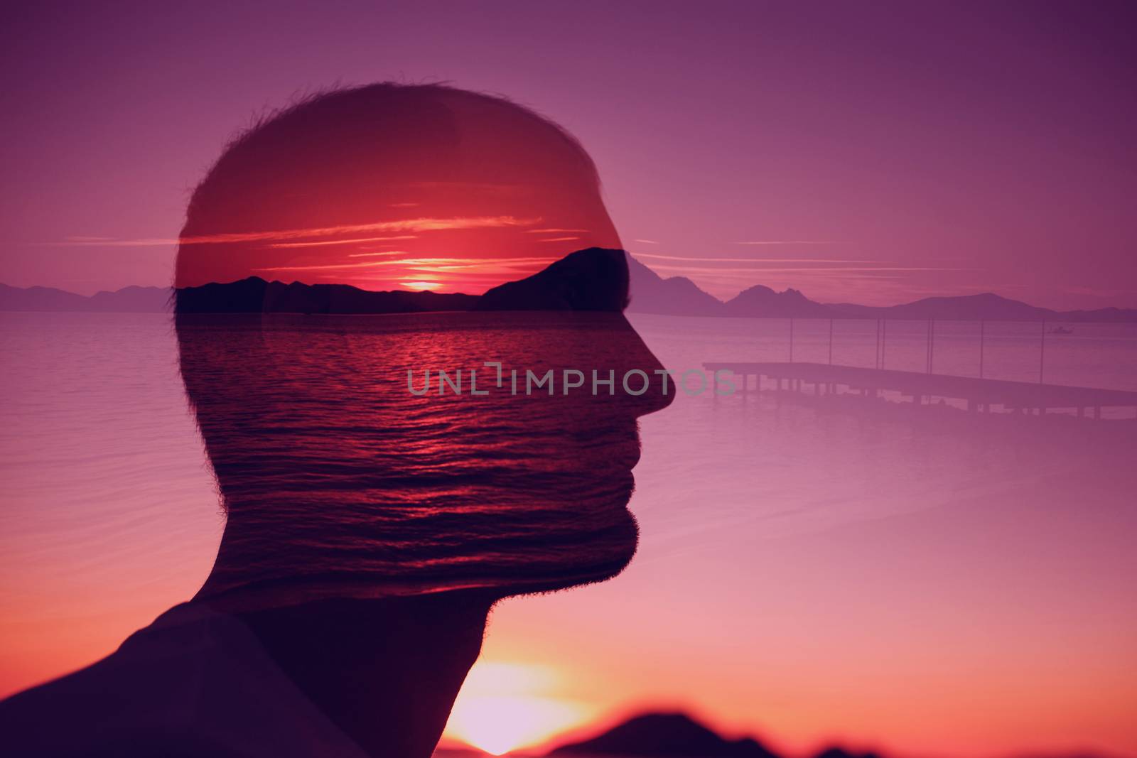 Silhouette young man on background of sunset over the sea. Multiple exposure. Creative ideas, peace emotions, abstract thinking concept. by primipil